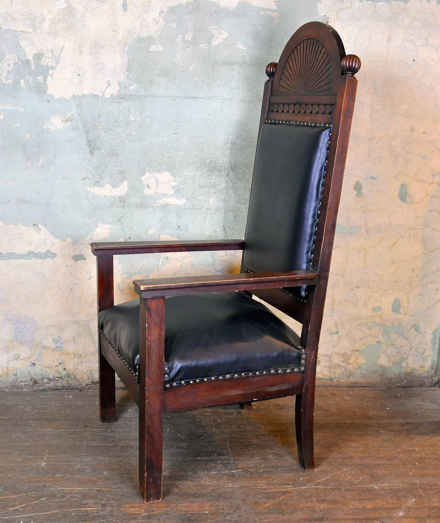 Manufactured by the Shaw Furniture Company of Boston, Massachusetts, these beautiful high-back lodge chairs have a wonderful decorative arched detail carved in walnut. Both chairs vary in size. 

One is 59.75" tall x 27.5" wide x 27"