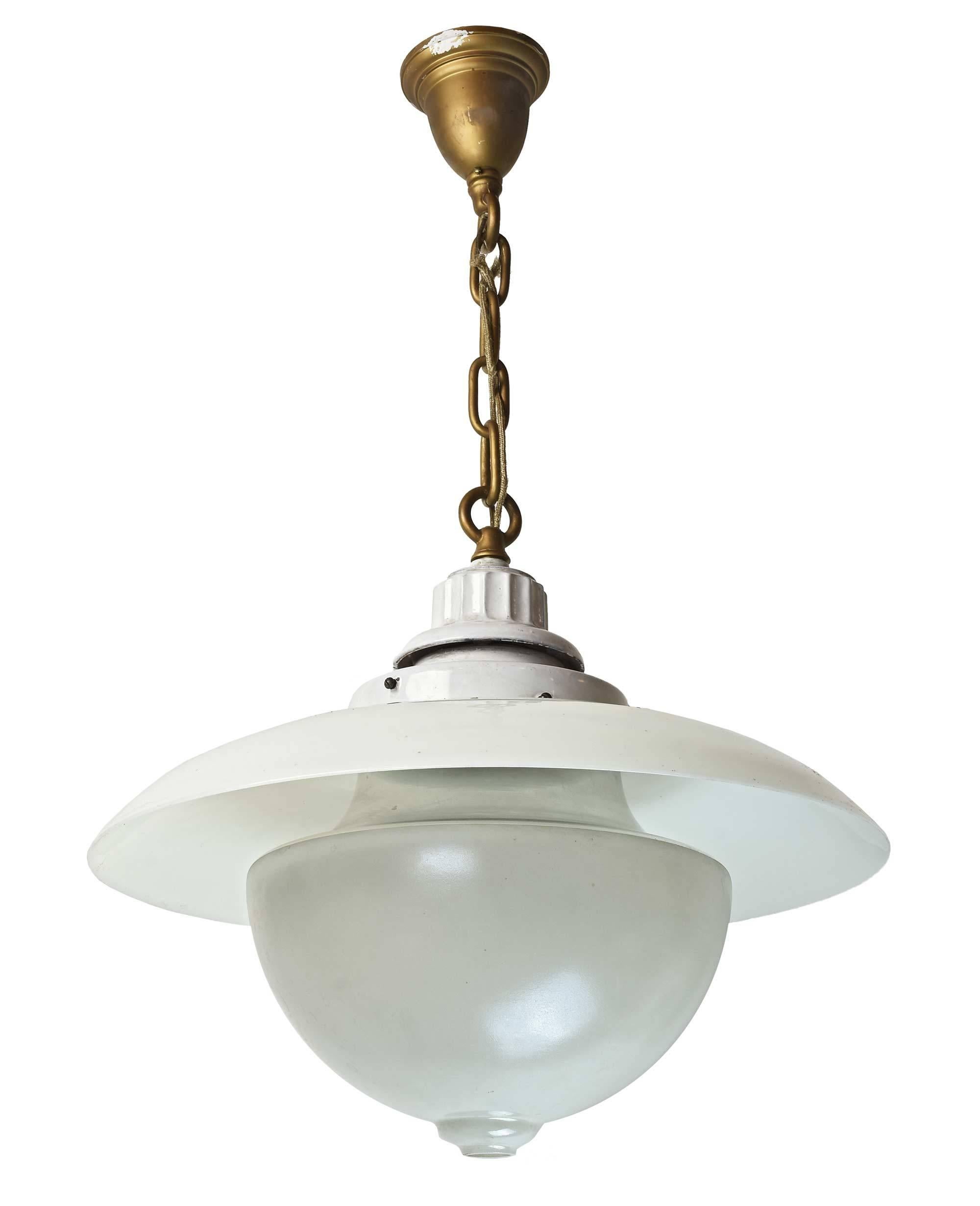 This is a great Beardslee transitional fixture. As Industrial lights moved towards what is now considered the 'school house' style, glass was used to deflect light. This unique two-piece system includes the reflector shade and the opaque main shade,
