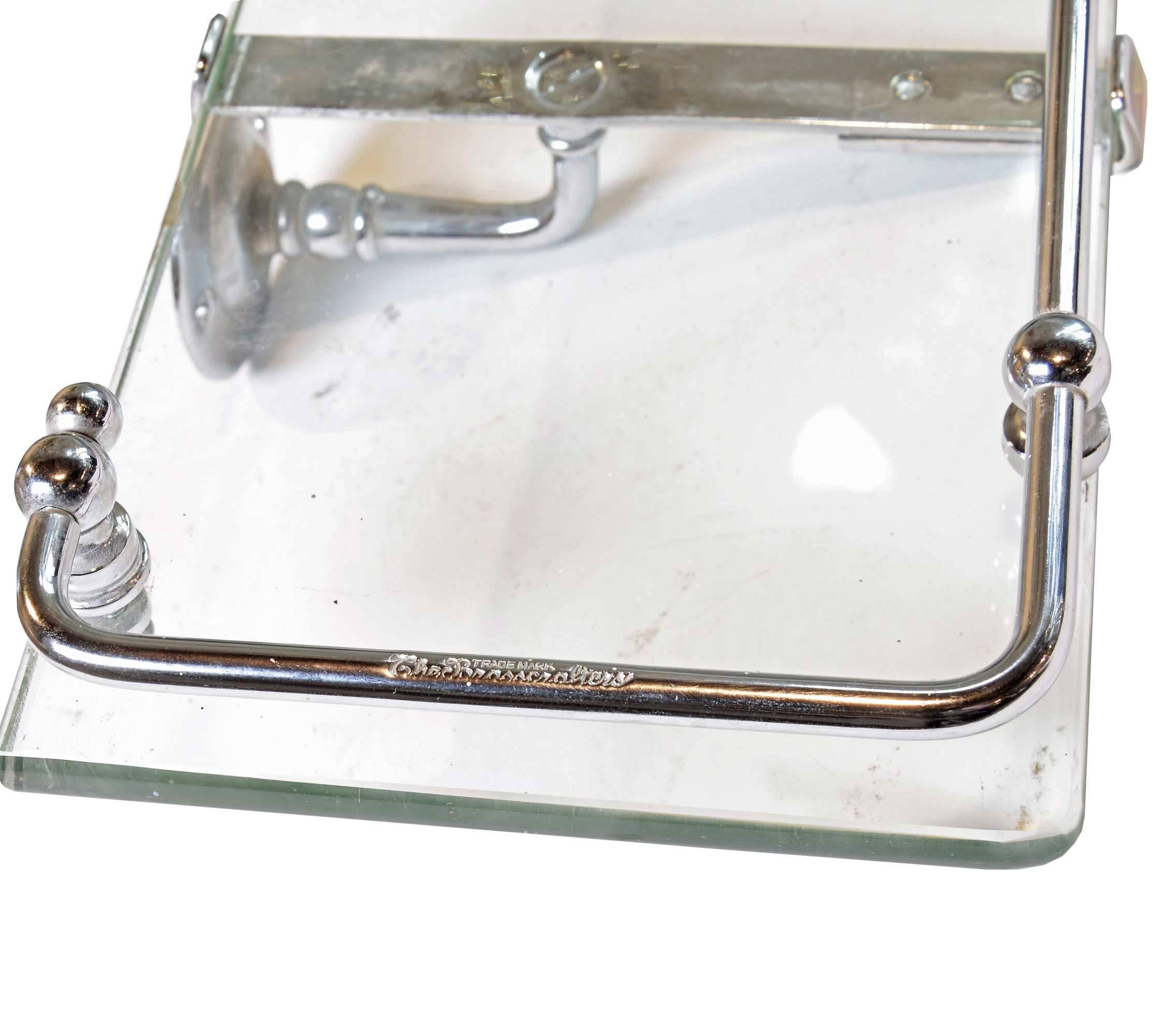 Glass and nickel-plated bath shelf with rail by The Brasscrafter, the premier company of the early 1900s for lavatory and bath accessories. The bath shelf is in pristine condition with no losses in the nickel, the glass plate is free of chips and