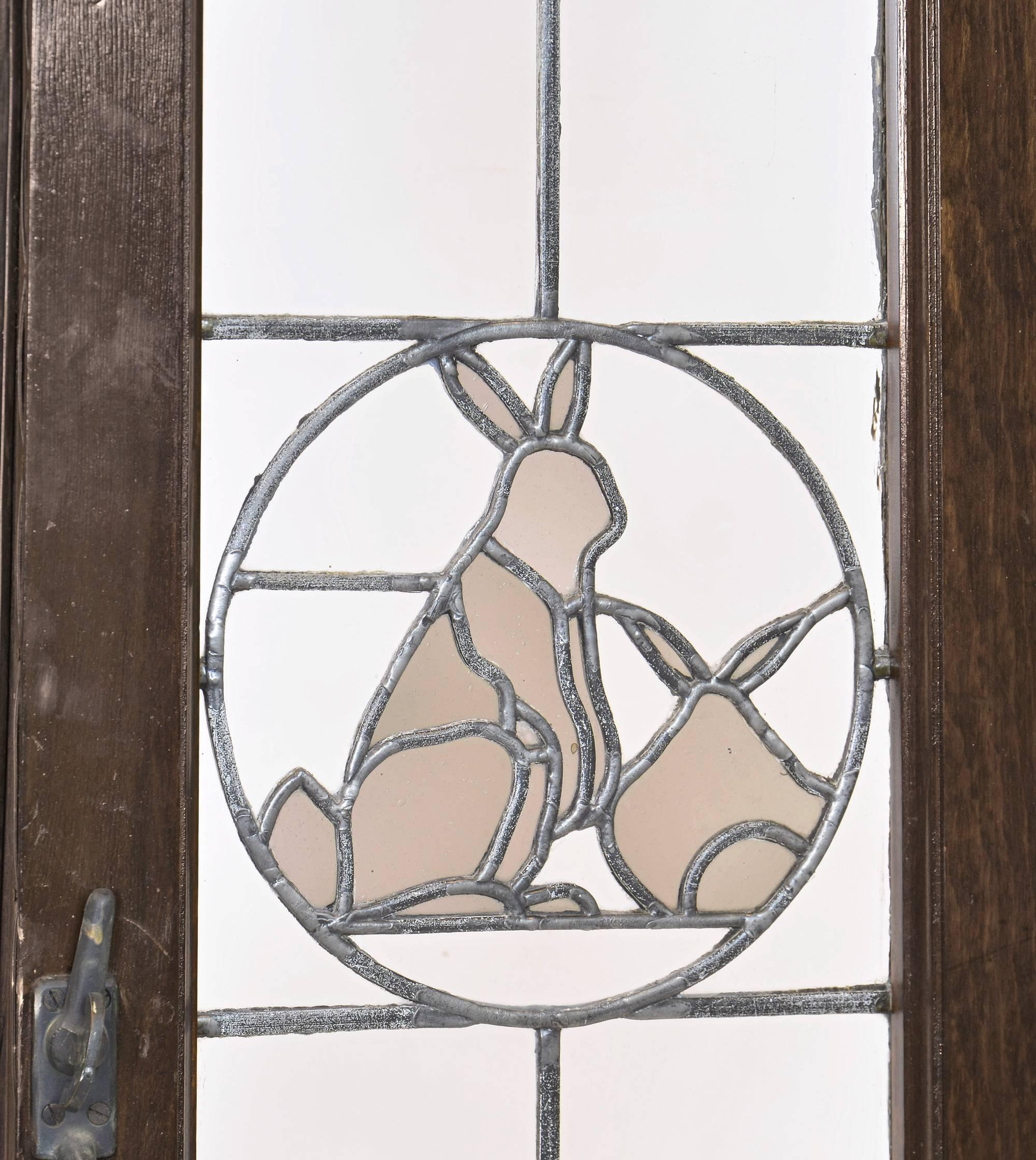 Set of Eight Tudor French Windows with Leaded Glass Emblems, circa 1915 In Good Condition In Minneapolis, MN