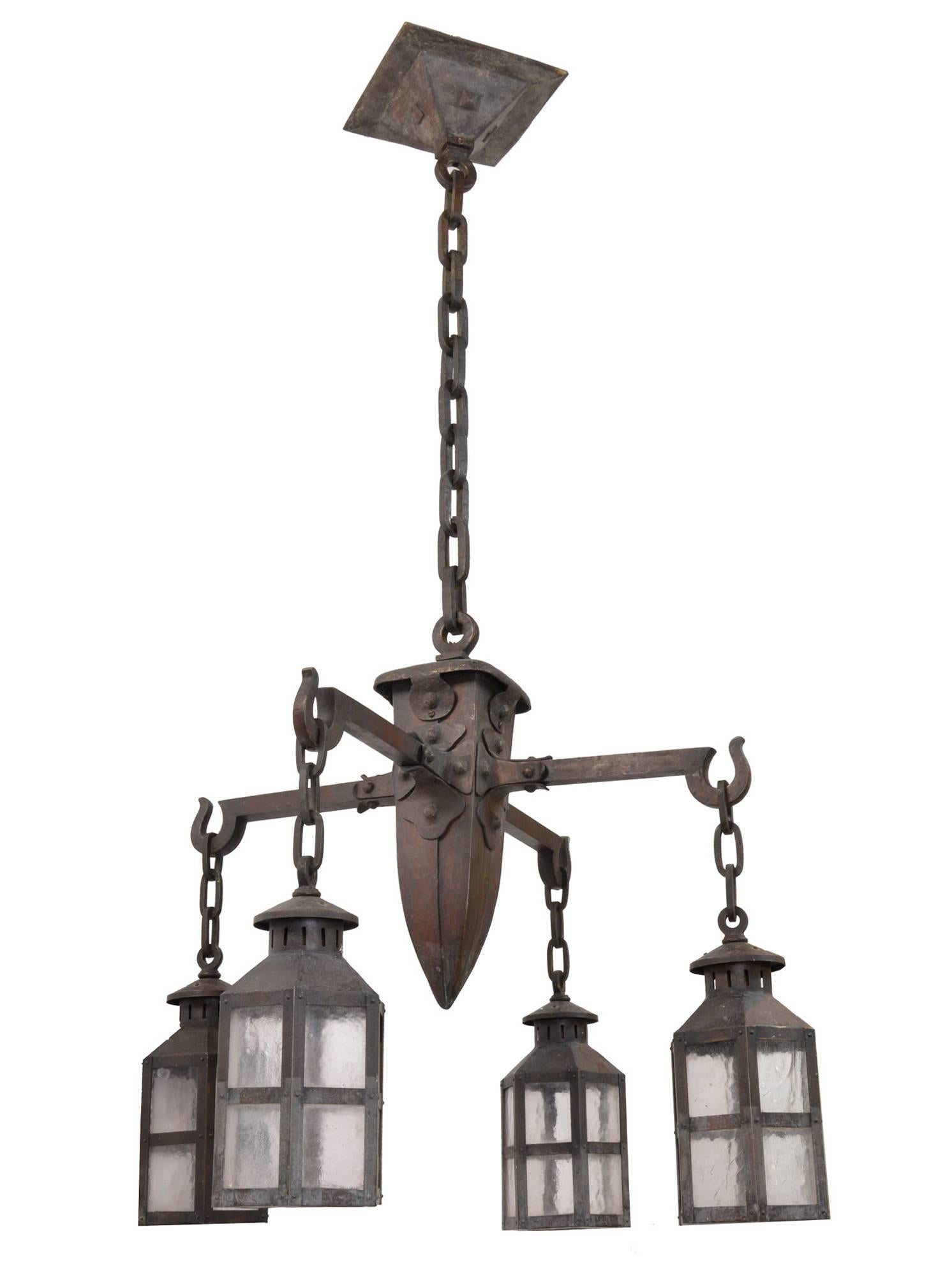 This authentic Arts and Crafts chandelier has a great mix of details that make it truly special. Incorporated are utilitarian shapes, functionality, and handcrafted ornamentation that defines Arts and Crafts design sensibilities. With its original