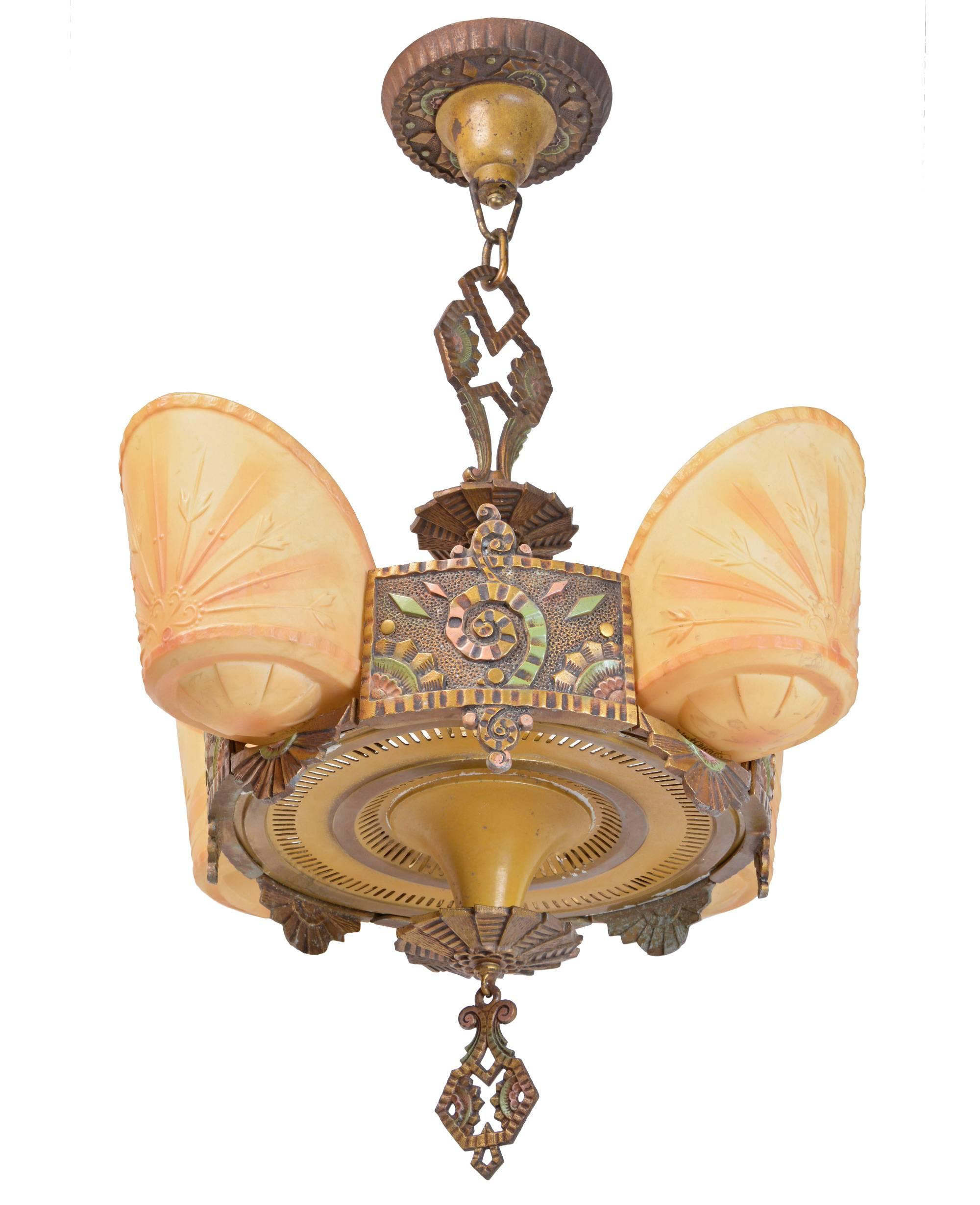 Produced by Williamson & Co, Chicago’s Premium lighting supplier in the 1930s, this chandelier is a truly rare find in antique Art Deco glass and ‘slipper shades.’ 

Often this design is signed both Williamson and Beardslee, a lighting firm out of