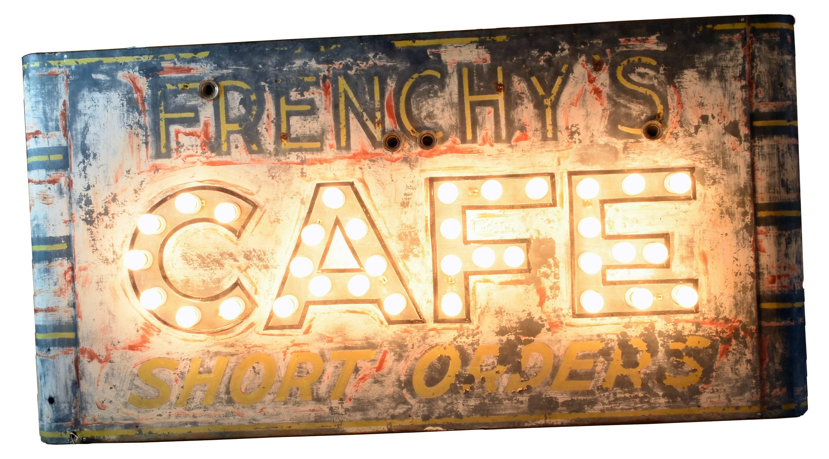 This sign, circa 1930s features a wonderful patina of old Classic colors on a steel base. This café sign recollects the graphic advertising of the mid-20th century in its use of bold sans serif typography and bright colors. The formerly lit neon