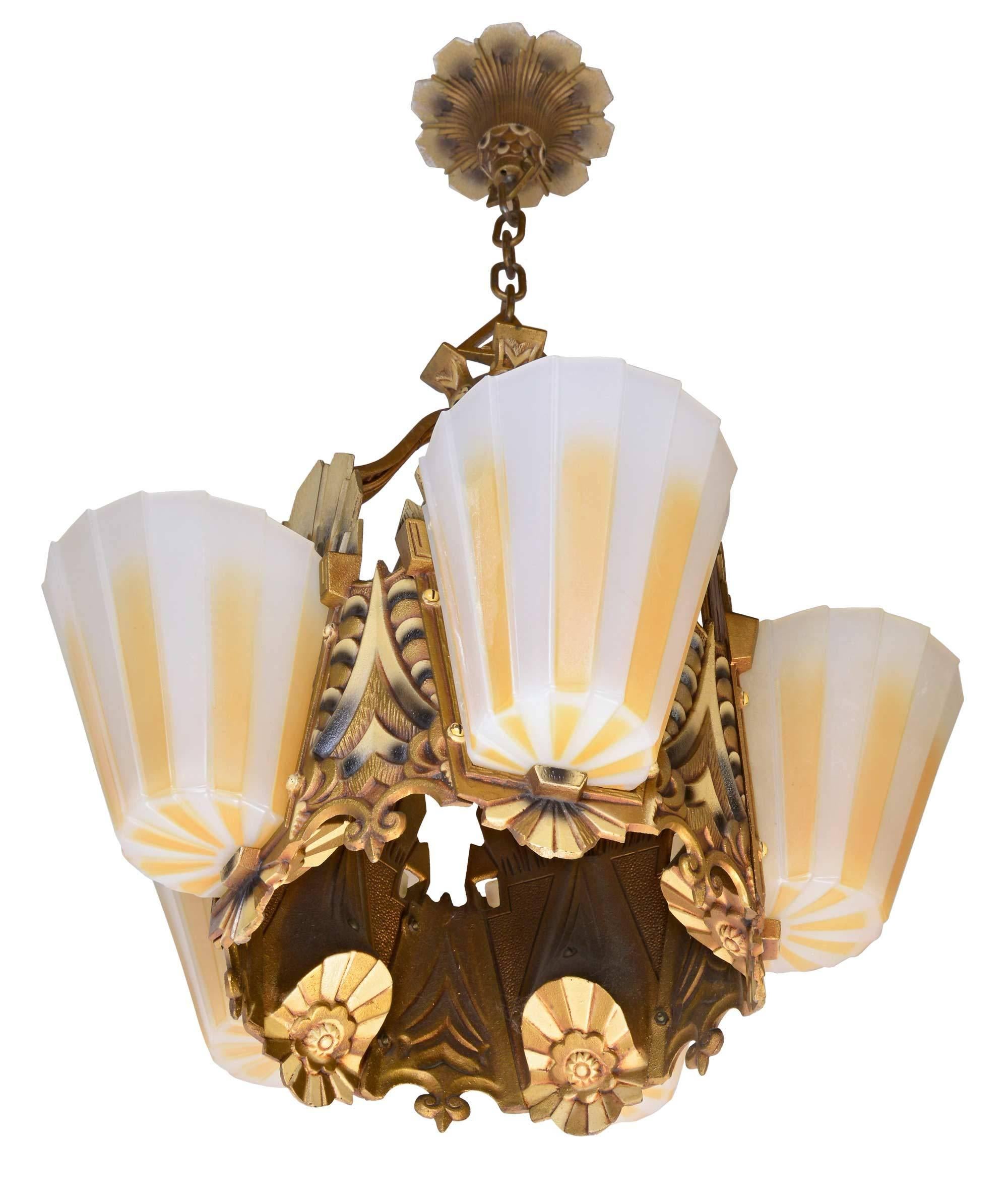 Iron five-light Williamson/Beardslee Art Deco chandelier with original polychrome finish and five striped slipper shades, by Williamson/Beardslee Manufacturing Co. of Chicago, IL. 

We find that early antique lighting was designed as objects of