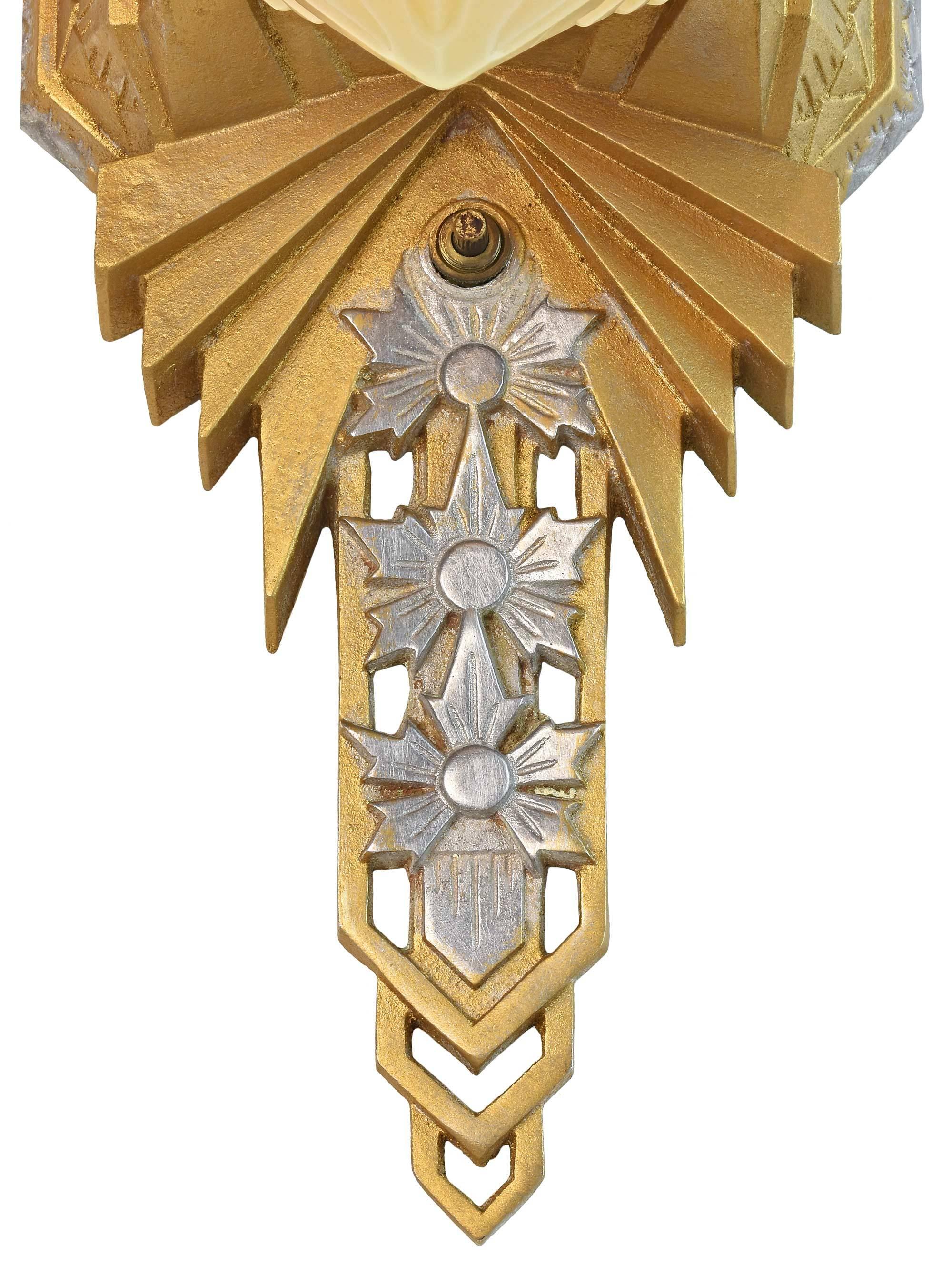 This rare and marvelous sconce is believed to be manufactured by Lincoln Lighting Co. in the 1930s and was created as a 'presentation' piece given to the company's top sales personnel or to retirees as a gift. Made of cast aluminum, each sconce is