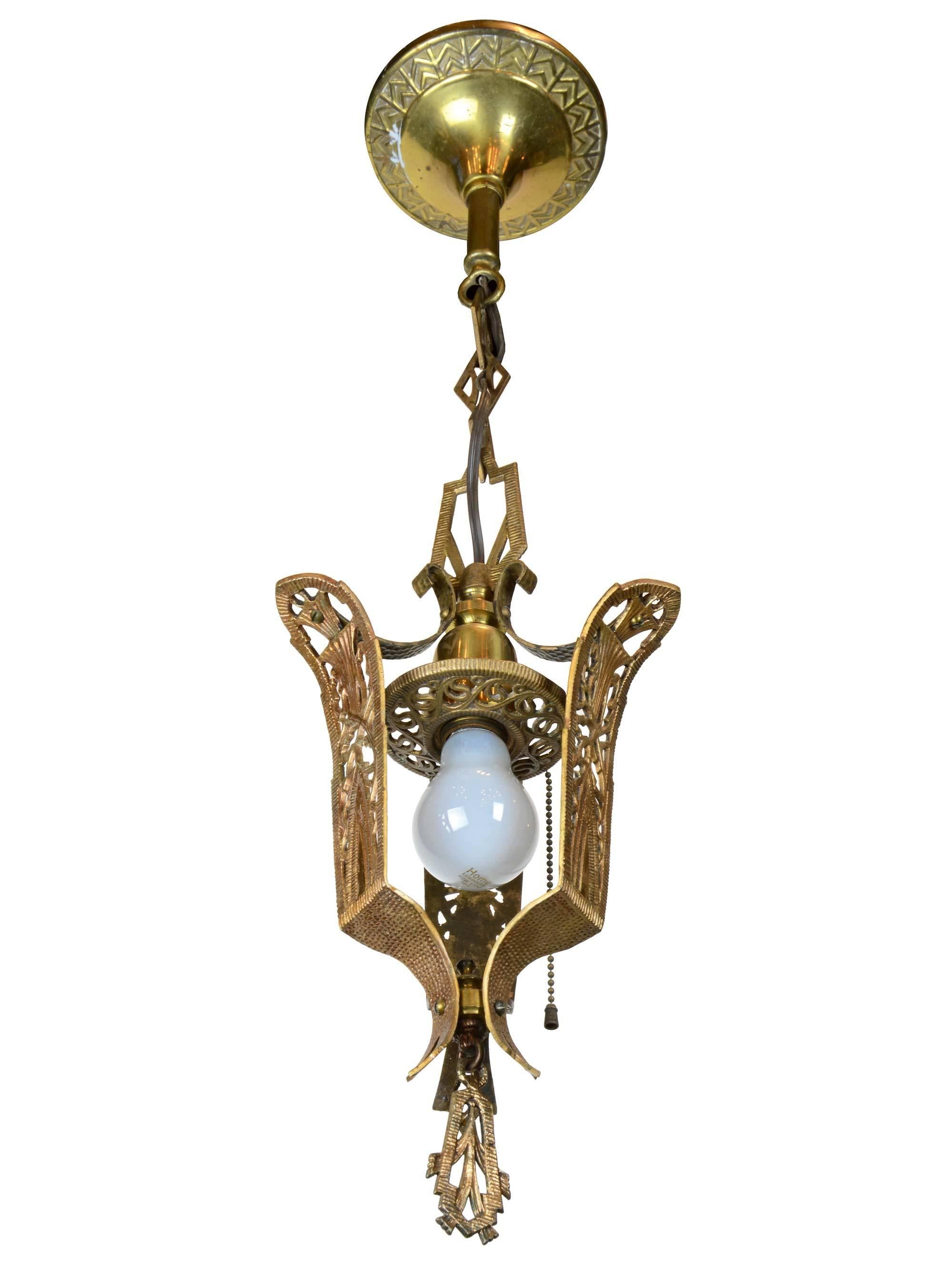 Gorgeous brass hall pendant with Art Deco detailing throughout. This fixture is sure to add a touch of elegance to any home. Pair it with the matching five light chandelier to really be transported back in time. (Search reference #46750)

We find