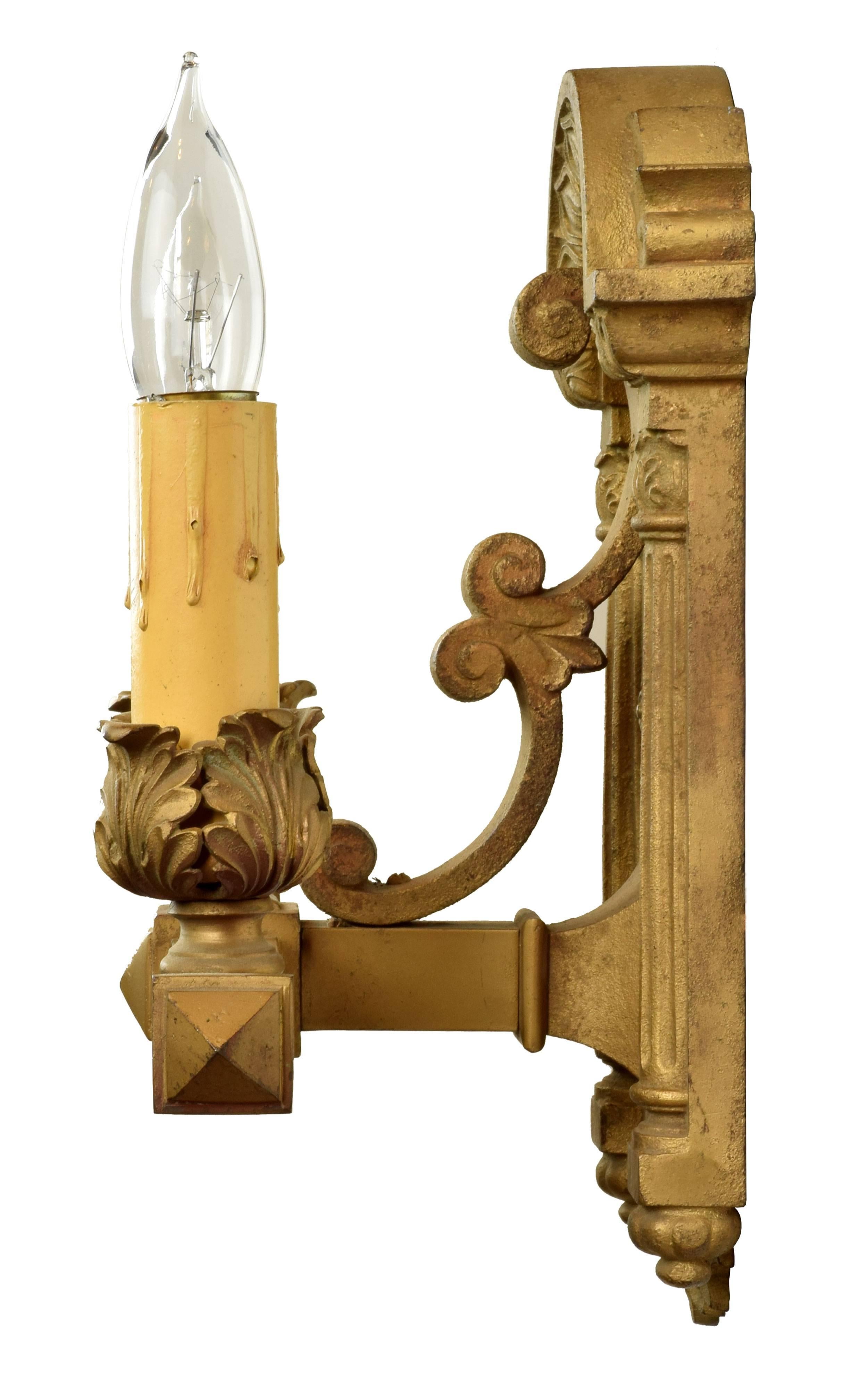 Straight, angular lines are juxtaposed beautifully with curving, leafy designs in this pair of heavy cast iron sconces. A beautiful golden finish adds a luxurious richness to each piece. 

Two medium sockets

We find that early antique lighting