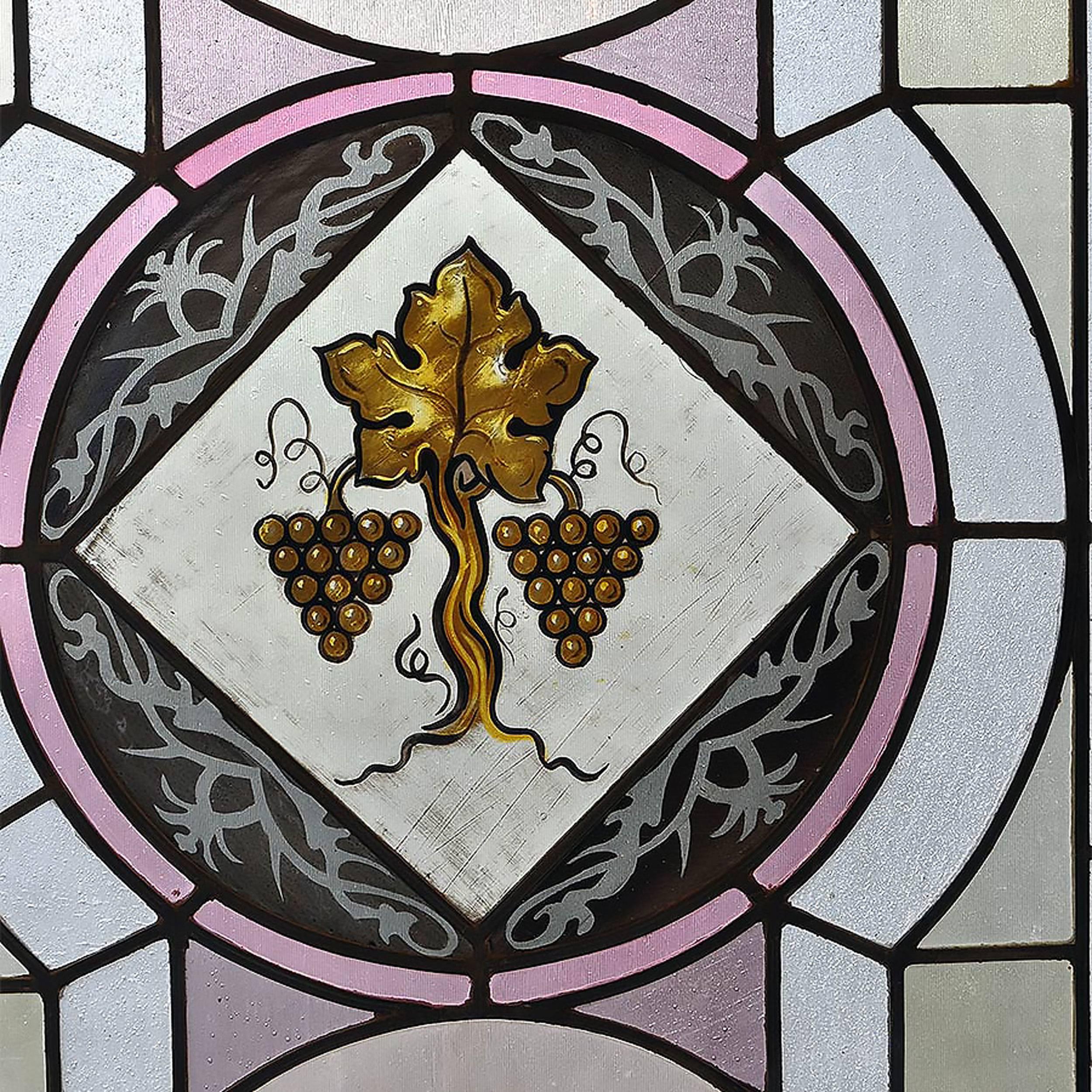 Gothic windows with hand-painted emblems and stained glass in a variety of pastel colors. These windows are complete in frames and there are four different sizes available with a variety of designs. Please contact us if you are interested in more