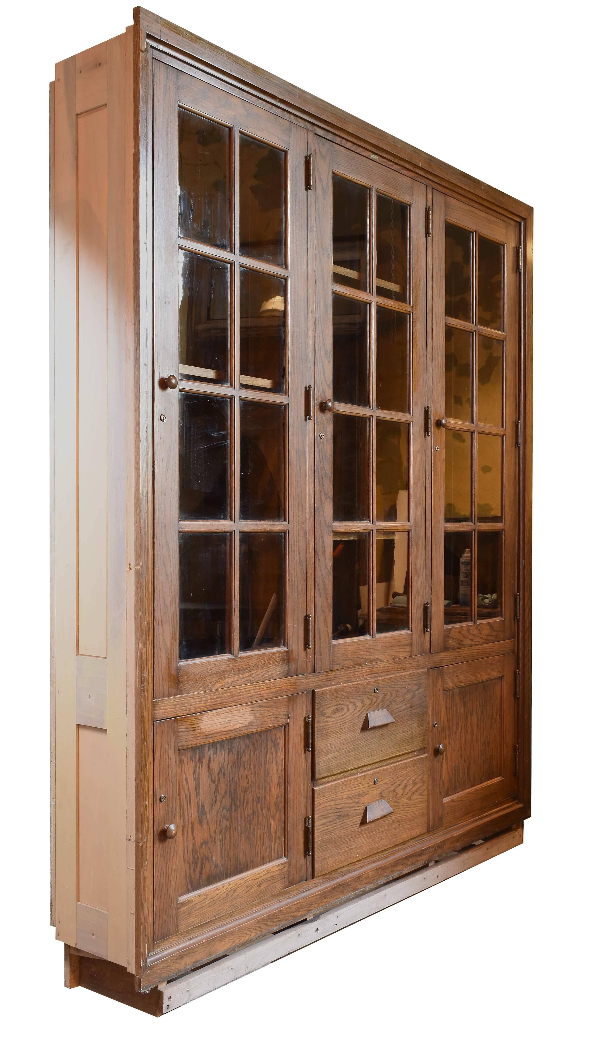 This built-in stained fumed oak school room cabinets are a great example of early American craftsmanship. There is plenty of storage space with three (19.75