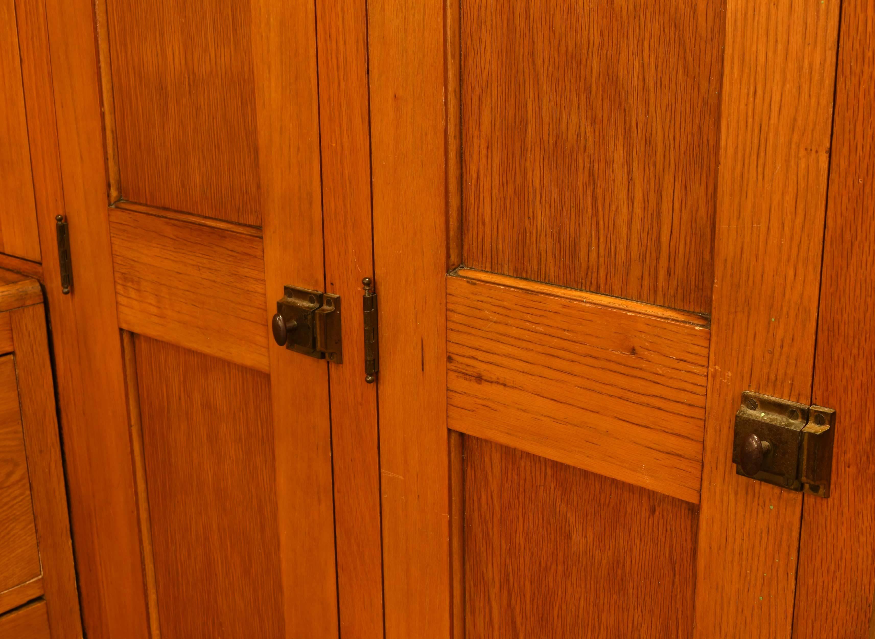 This golden oak turn-of-the-century corner locker unit is the perfect size. It has lots of storage space with two full sized lockers, set of drawers and top cabinet space.

This self contained locker features a right corner of two 14