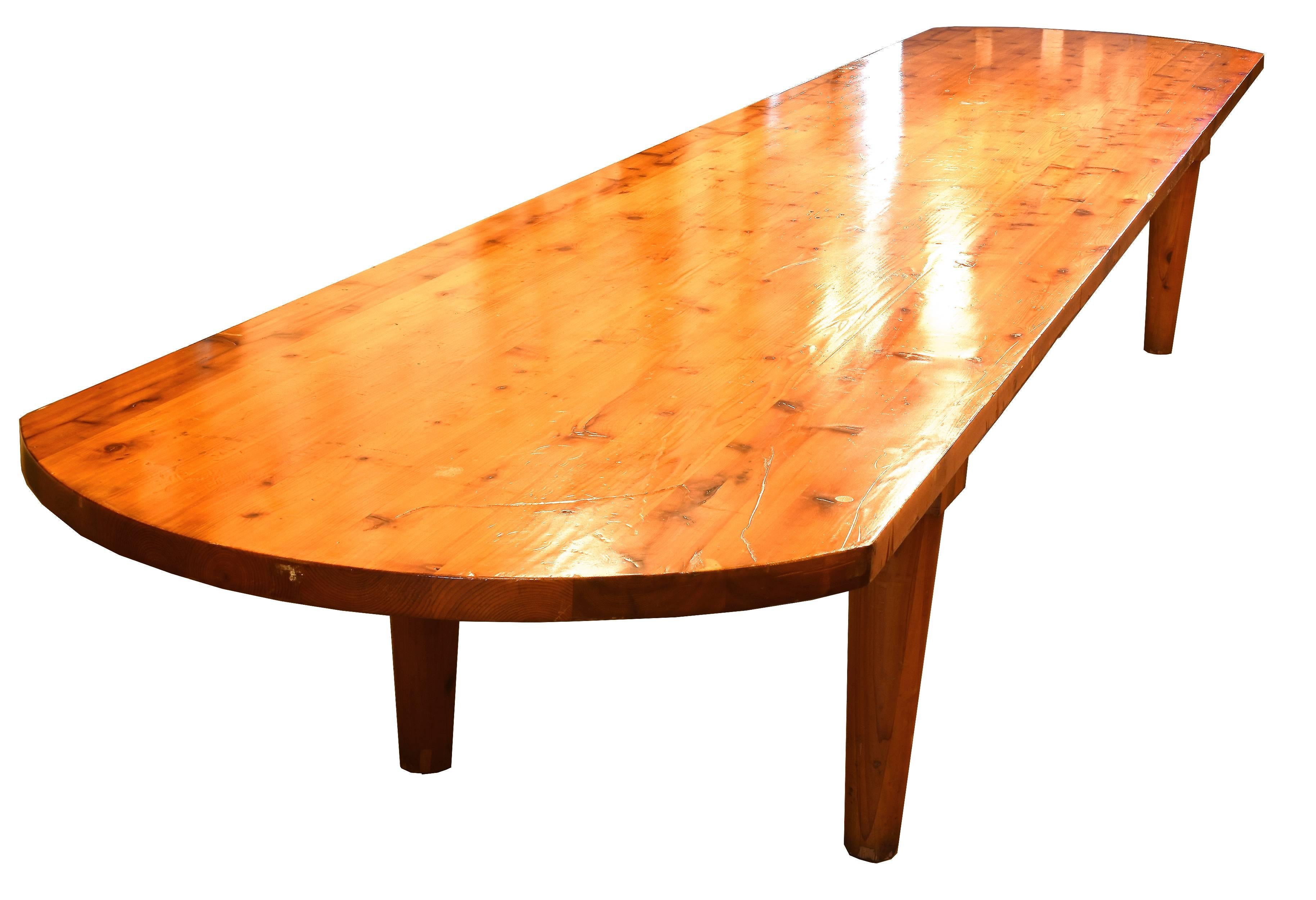 At over 16 feet long, this incredible pine table is a true statement piece! Gently curved edges create nice flow and a smooth matte finish enhances the beautiful wood grain. 

Measures: 29