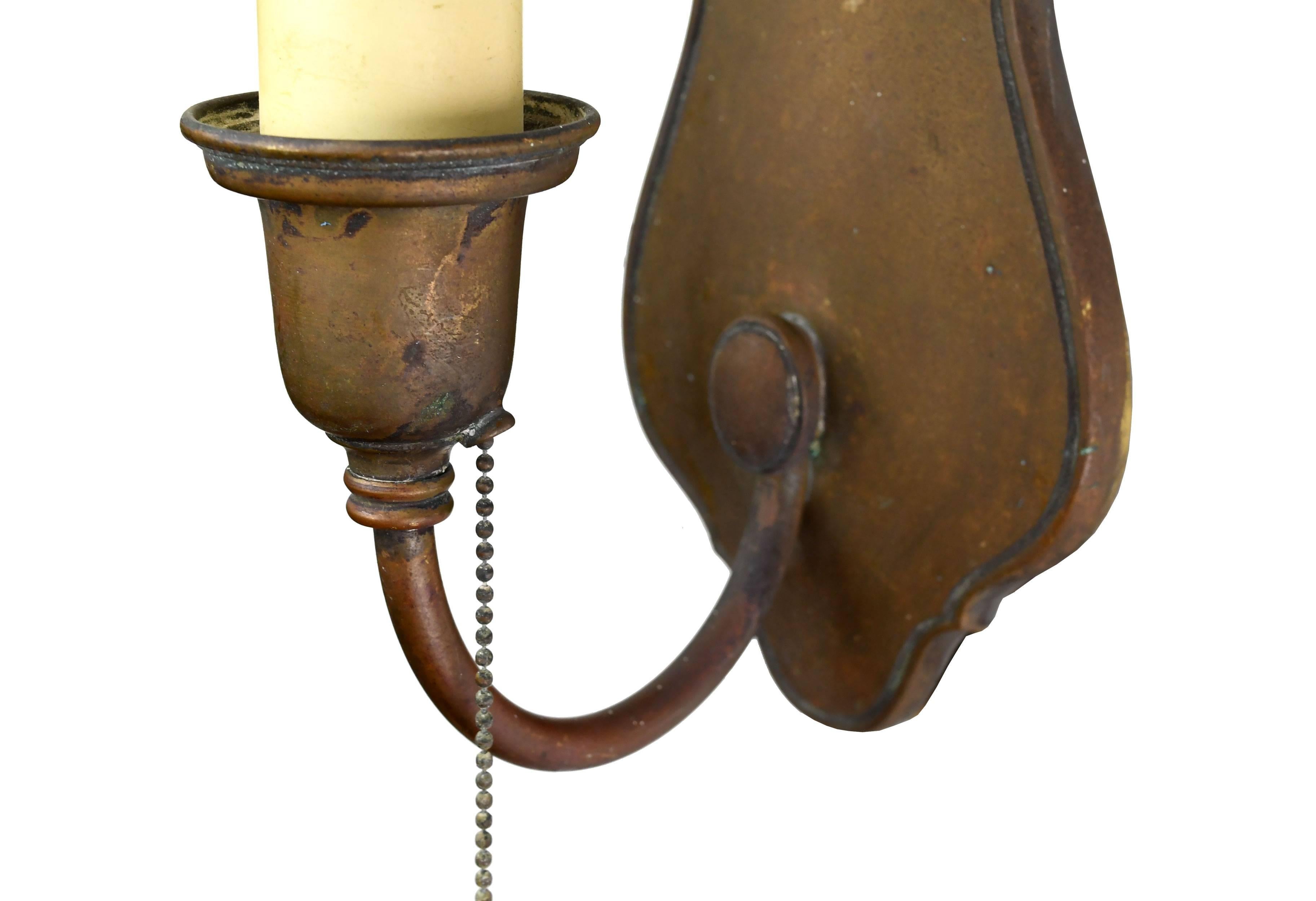 These timeless cast brass sconces are stamped 