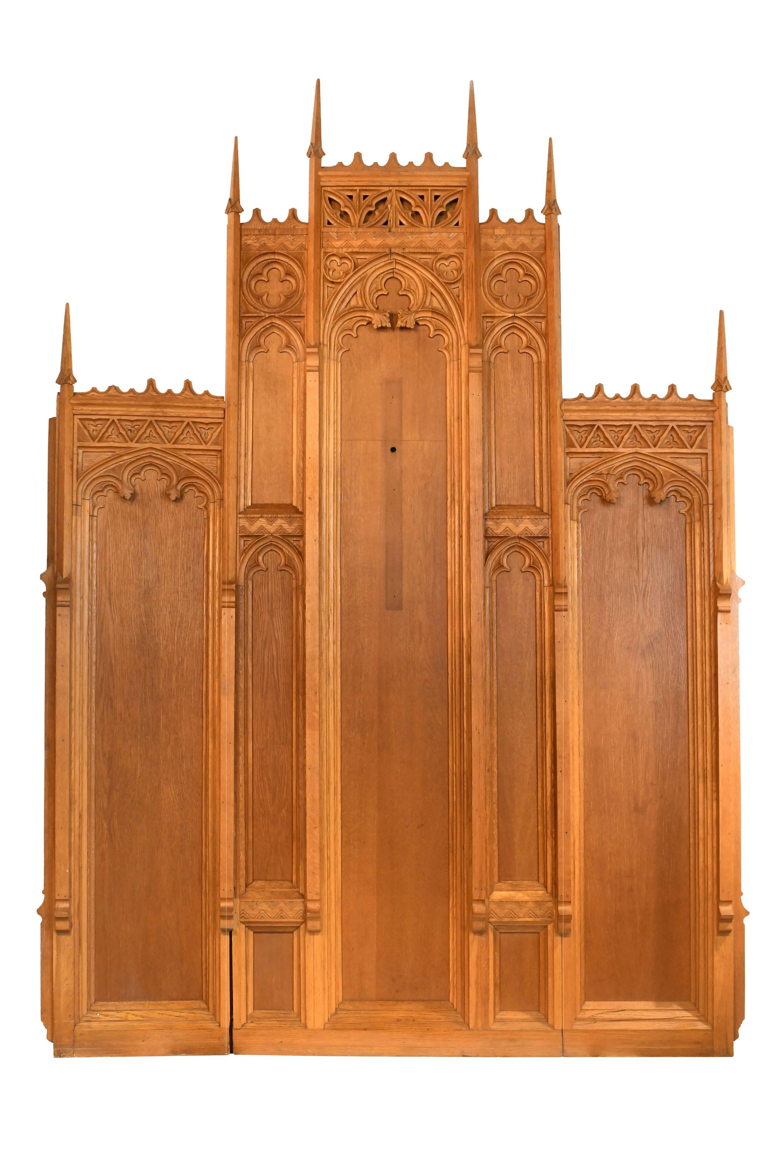 This incredible three piece oak altarpiece will add a sense of drama to any space. Spire-like finials, Gothic elements, and quartersawn details are peppered throughout, adding an abundance of architectural interest,

circa 1930
Condition: