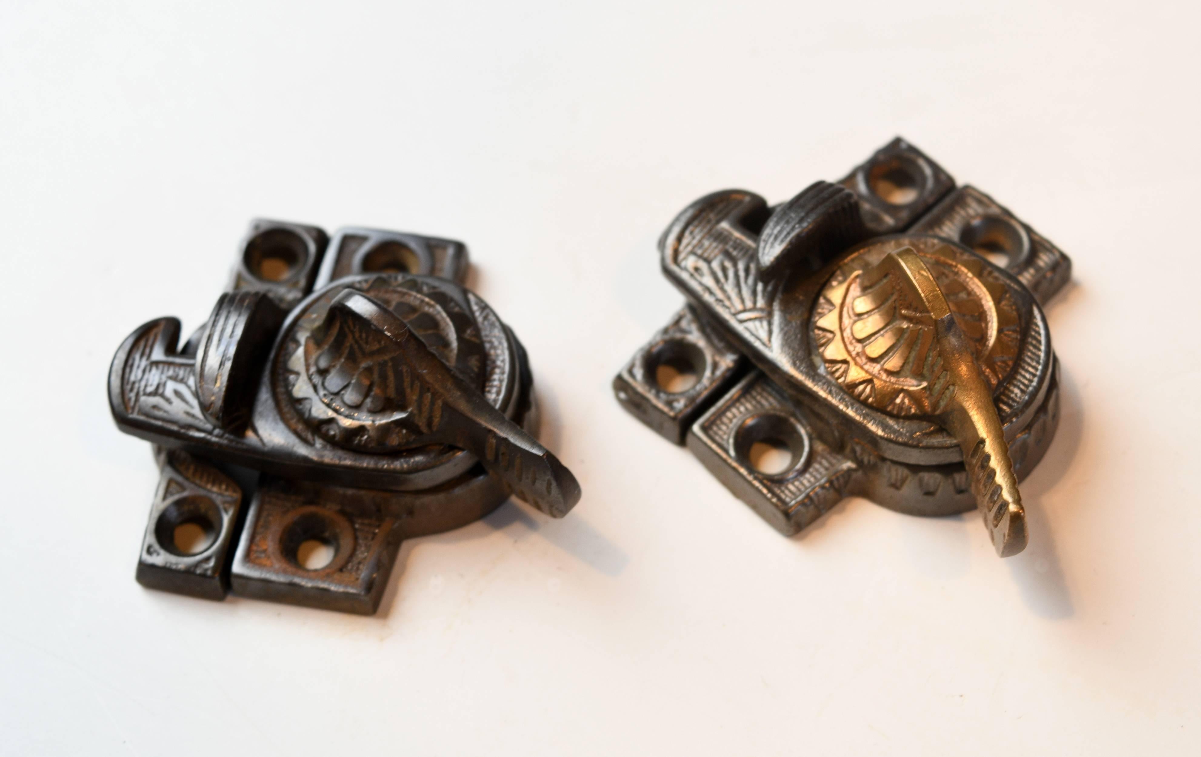Eagle Claw design window locks. Eastlake styling of cast iron with iron or bronze thumb lock. 

Variants: A. Iron thumb lock (12 available) / B. bronze thumb lock (11 available)