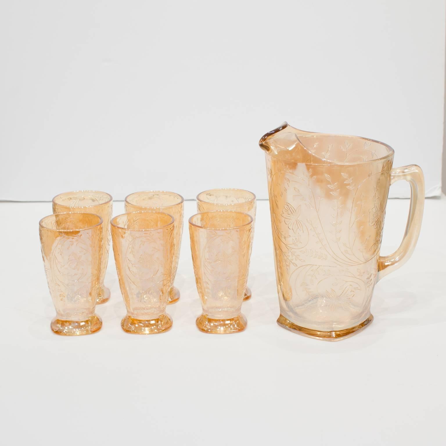 1950s etched Floragold (Louisa) iridescent pitcher and glass set made by Jeannette Glass. Set includes pitcher, six glasses, sugar and cream holder. Excellent condition.

Pitcher: 8.25