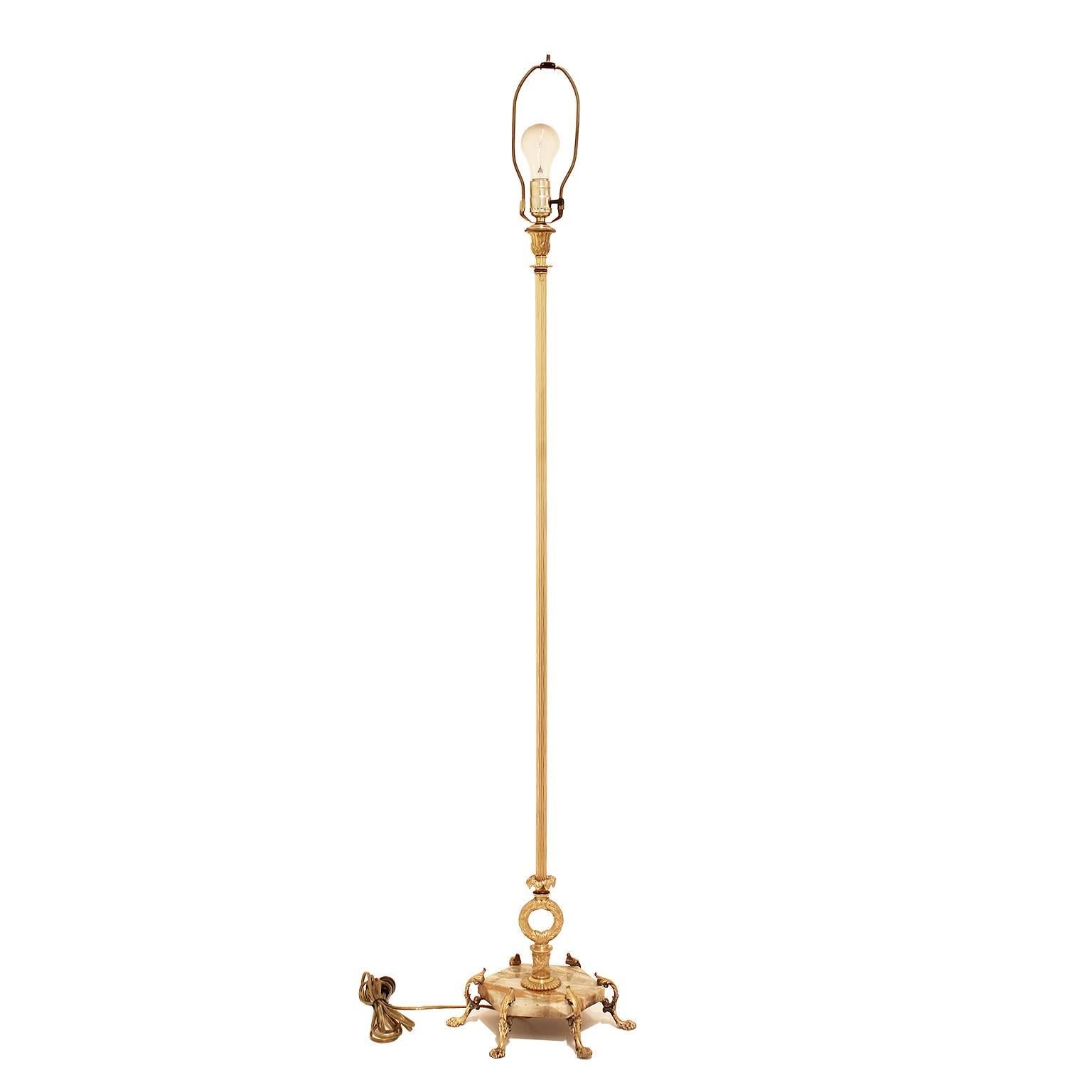 A rare 1920s French claw foot brass floor lamp with marble base.