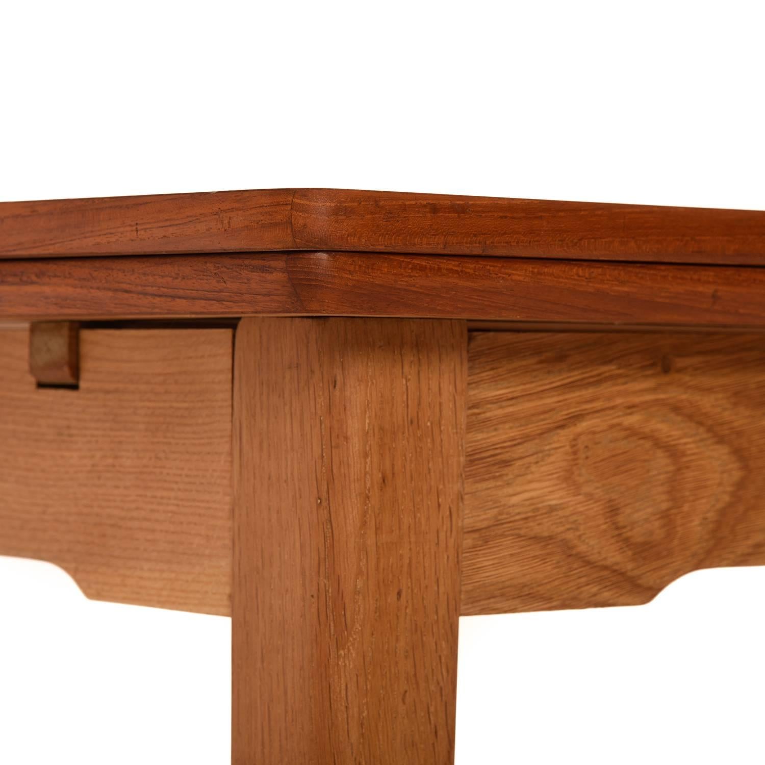 This lovely draw-leaf table is our favorite combination of woods (teak + white oak) and bowed edges to boot. The table includes (2) 19.5