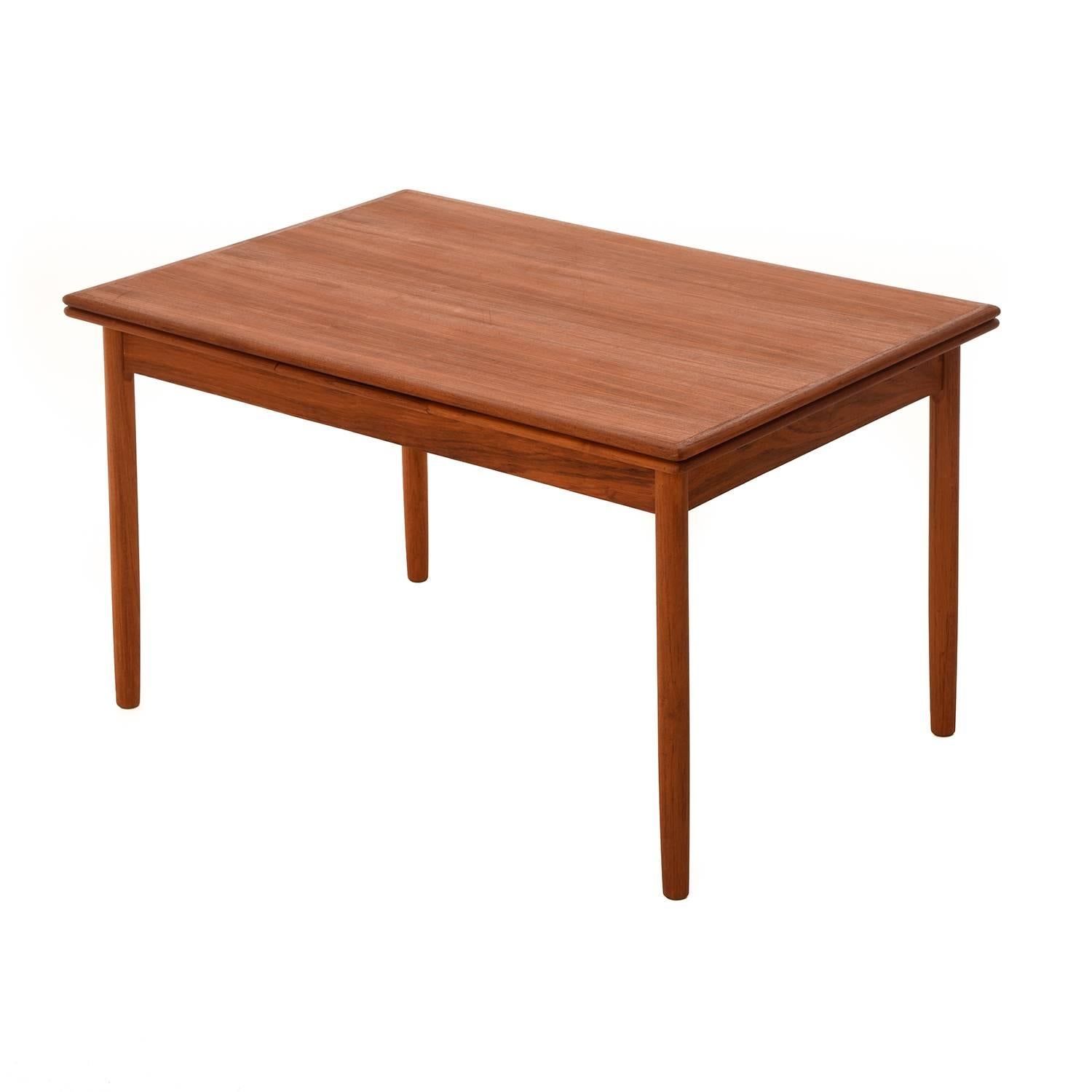 This is a lovely example of classic mid-20th century Danish innovation. Tuck under leaves are self storing and can be pulled on demand by catching fingerhold underneath leaves. One or both leaves can be used, the table stays level either way. Please