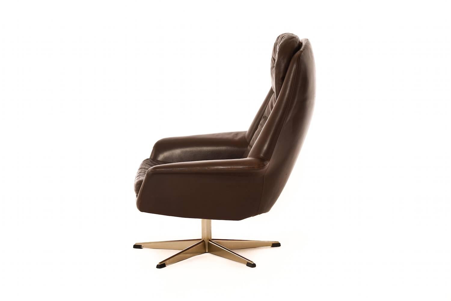 Fabulous leather upholstered easy chair with swiveling chrome base. 

Professional, skilled furniture restoration is an integral part of what we do every day. Our goal is to provide beautiful, functional furniture that honors its illustrious past.