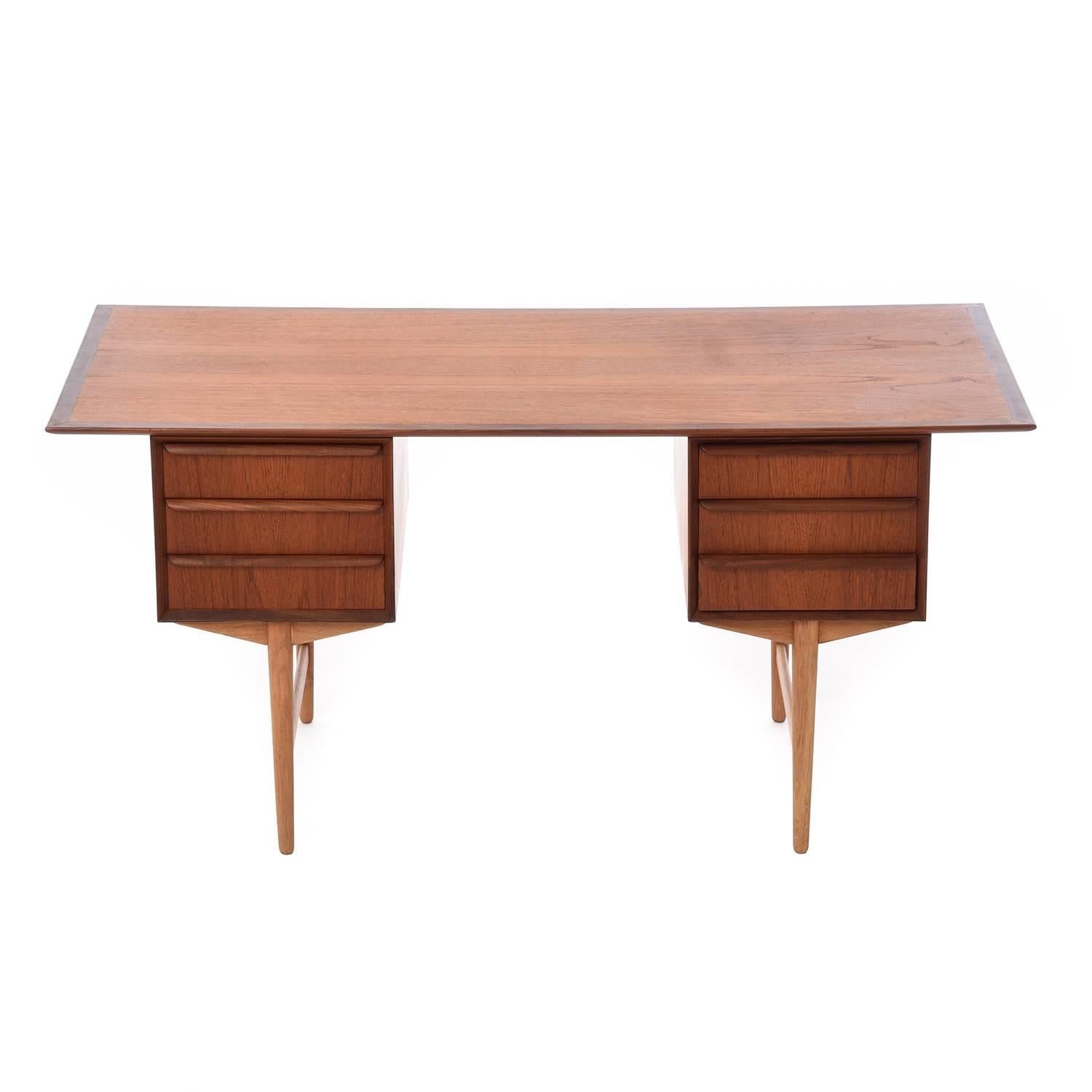 Beautiful teak and oak desk great for a home office or light desk work.

Professional, skilled furniture restoration is an integral part of what we do every day. Our goal is to provide beautiful, functional furniture that honors its illustrious