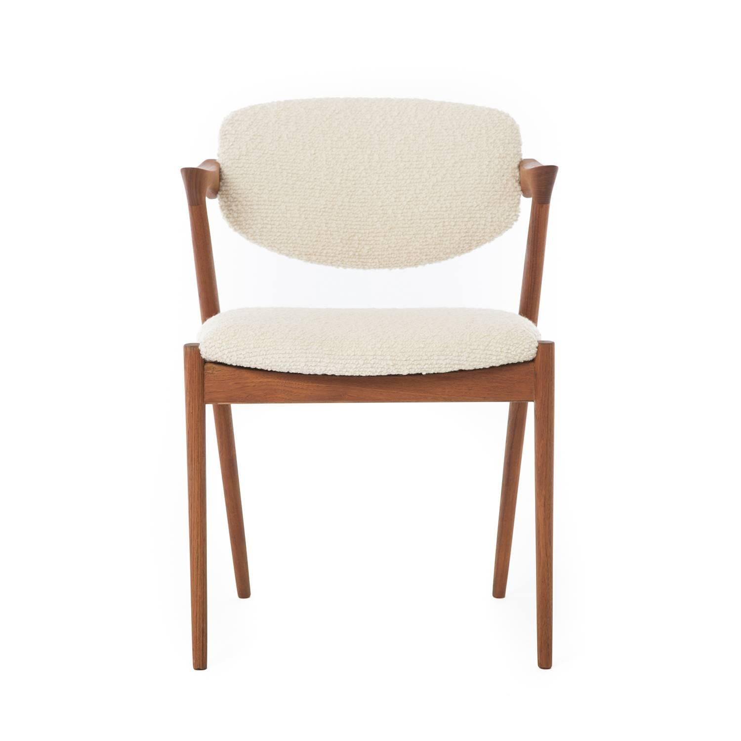 A gorgeous Kai Kristiansen occasional chair with Z-shaped arms. New upholstery in ivory "Cozy" boucle by Luna Textiles. (Chair shown in grey upholstery is sold). 

Professional, skilled furniture restoration is an integral part of what we