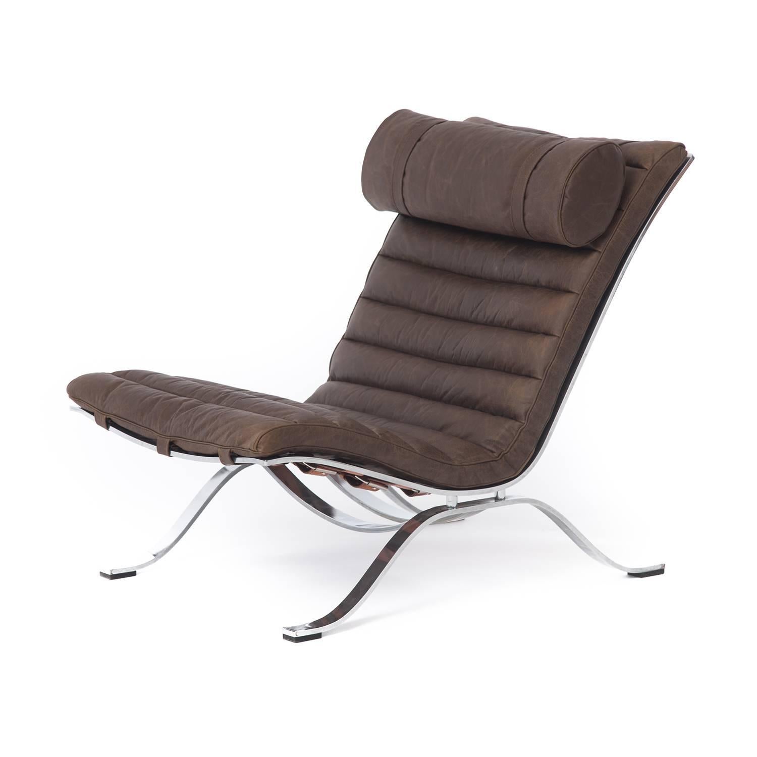 This classic lounge designed by Arne Norell for Arne Norell AB Sweden is crafted from a chromed steel frame and boasts new high quality upholstery in Italian leather by Studio Art.  Heavyweight, supple and pliable leather (cutting sample available