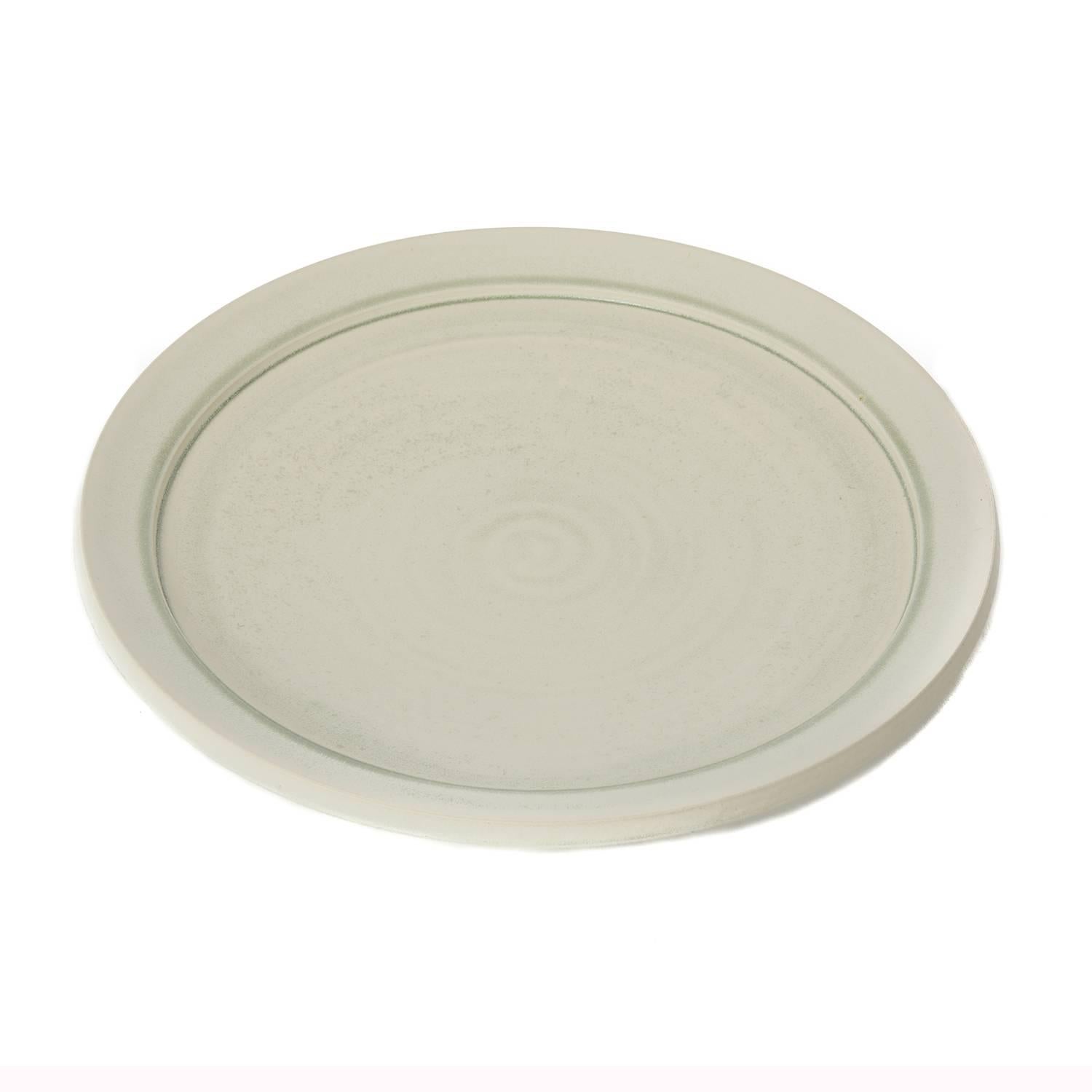 This new item is a glazed heavyweight large porcelain plate that is glazed with a pale 'mineral' grey green cast. Signed by the artist. Created by the artist for West Shore Collection, one of a kind. Appropriate as a stand alone object of art but