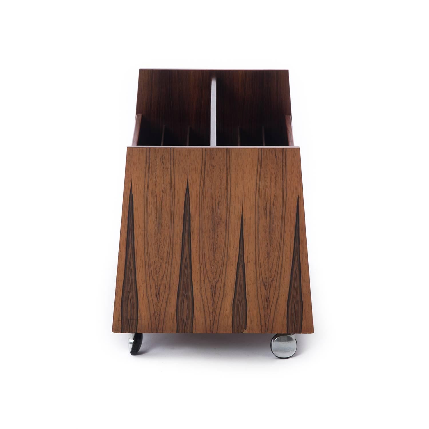 This handy and stylish piece is made of rosewood. Originally intended as a record album storage unit it can easily double as the ultimate magazine holder.

Professional, skilled furniture restoration is an integral part of what we do every day.