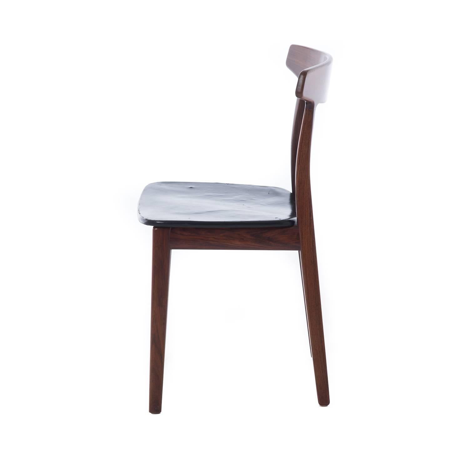 A sculptural stand alone that could be used in a variety of settings. The leather on this chair has been replaced and is new, mid-20th century modern Scandinavian design.

Professional, skilled furniture restoration is an integral part of what we