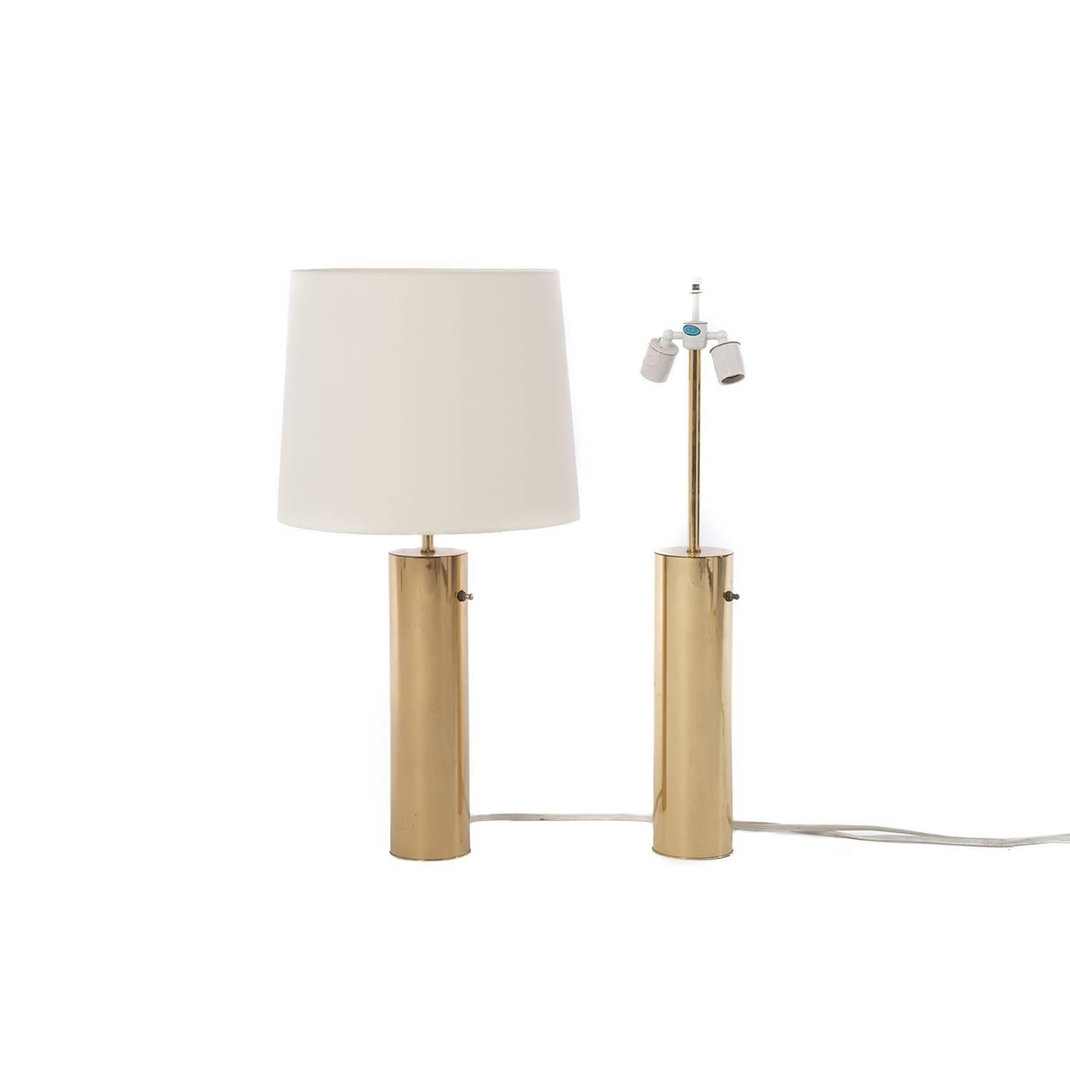 These heavyweight brass table lamps by Nessen create a warm glow in any room. New linen shades. Sold separately or as a pair.