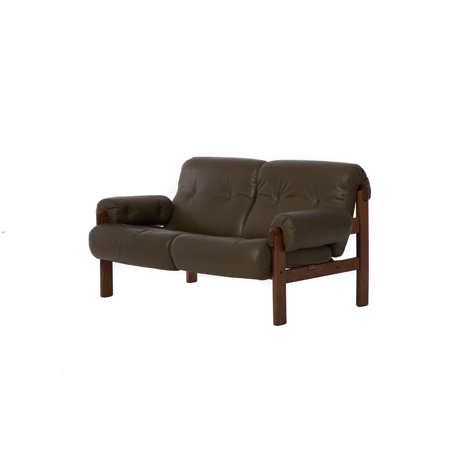 This Brazilian modern settee from the 1970s boasts original leather and leather webbing in excellent condition.

Professional, skilled furniture restoration is an integral part of what we do every
day. Our goal is to provide beautiful, functional