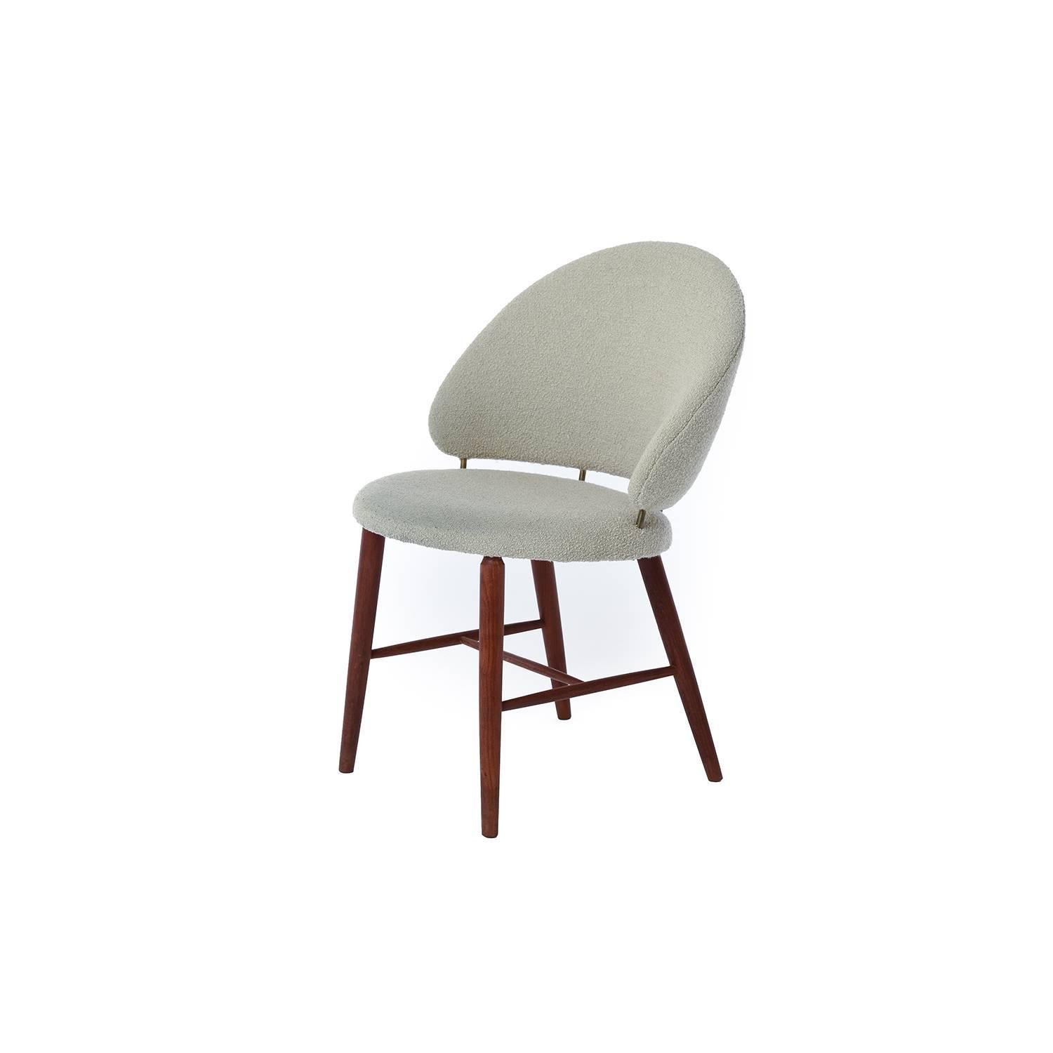 This Danish modern vanity chair is upholstered in a neutral Knoll Classic boucle wool with teak legs.