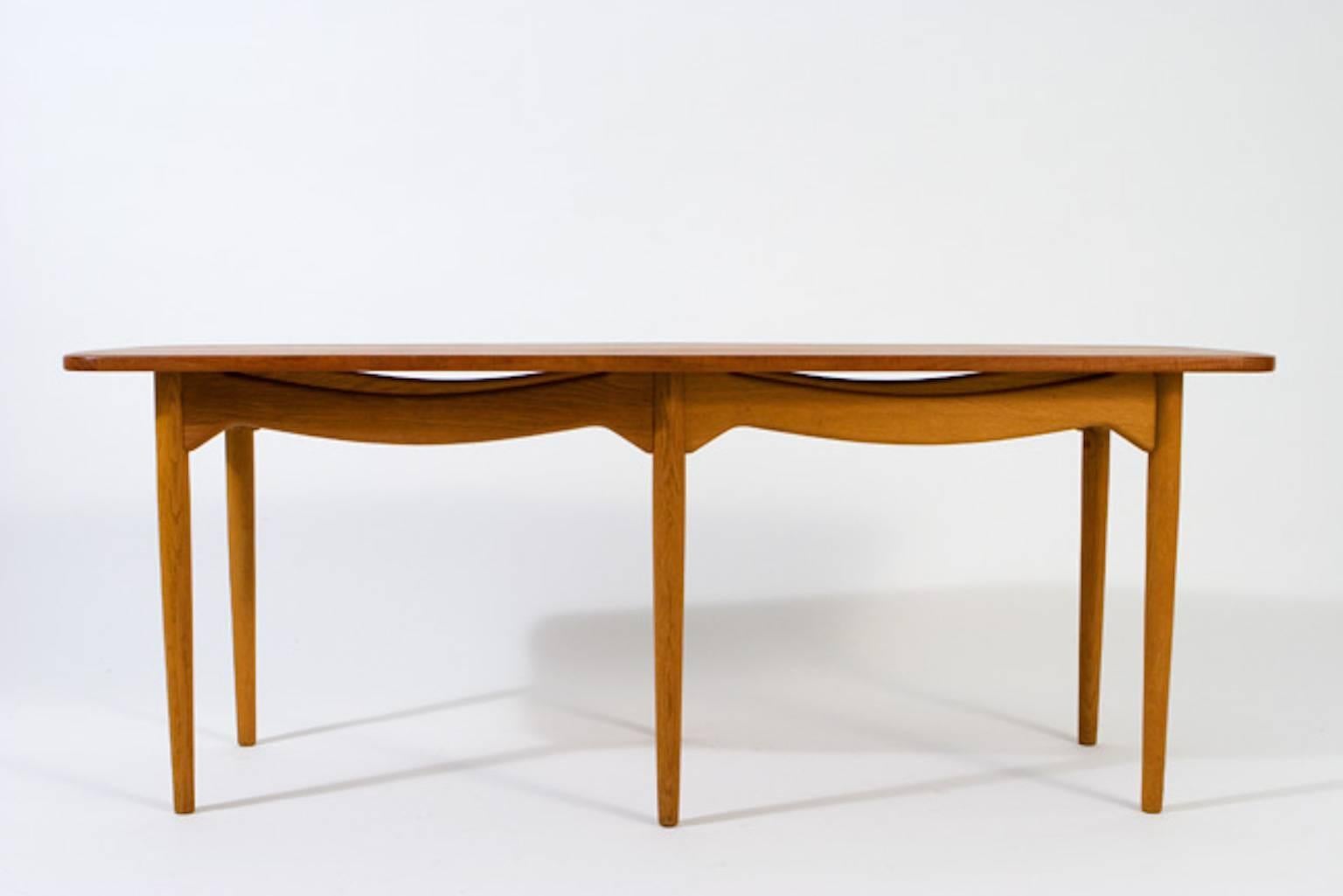 Vintage Danish coffee/cocktail table. Six legs, with teak top and oak base. Undulating stretcher.

Professional, skilled furniture restoration is an integral part of what we do every day. Our goal is to provide beautiful, functional furniture that
