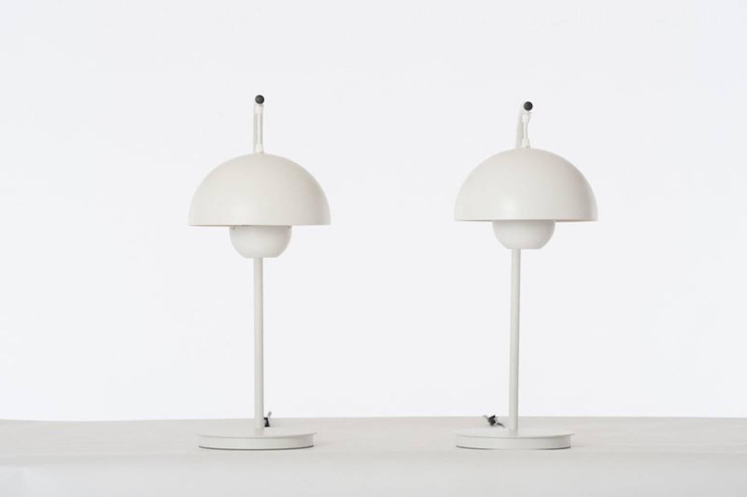 George Kovacs-designed table lamps in original, vintage condition. White aluminum with matte plastic shade. Pricing is for the pair.