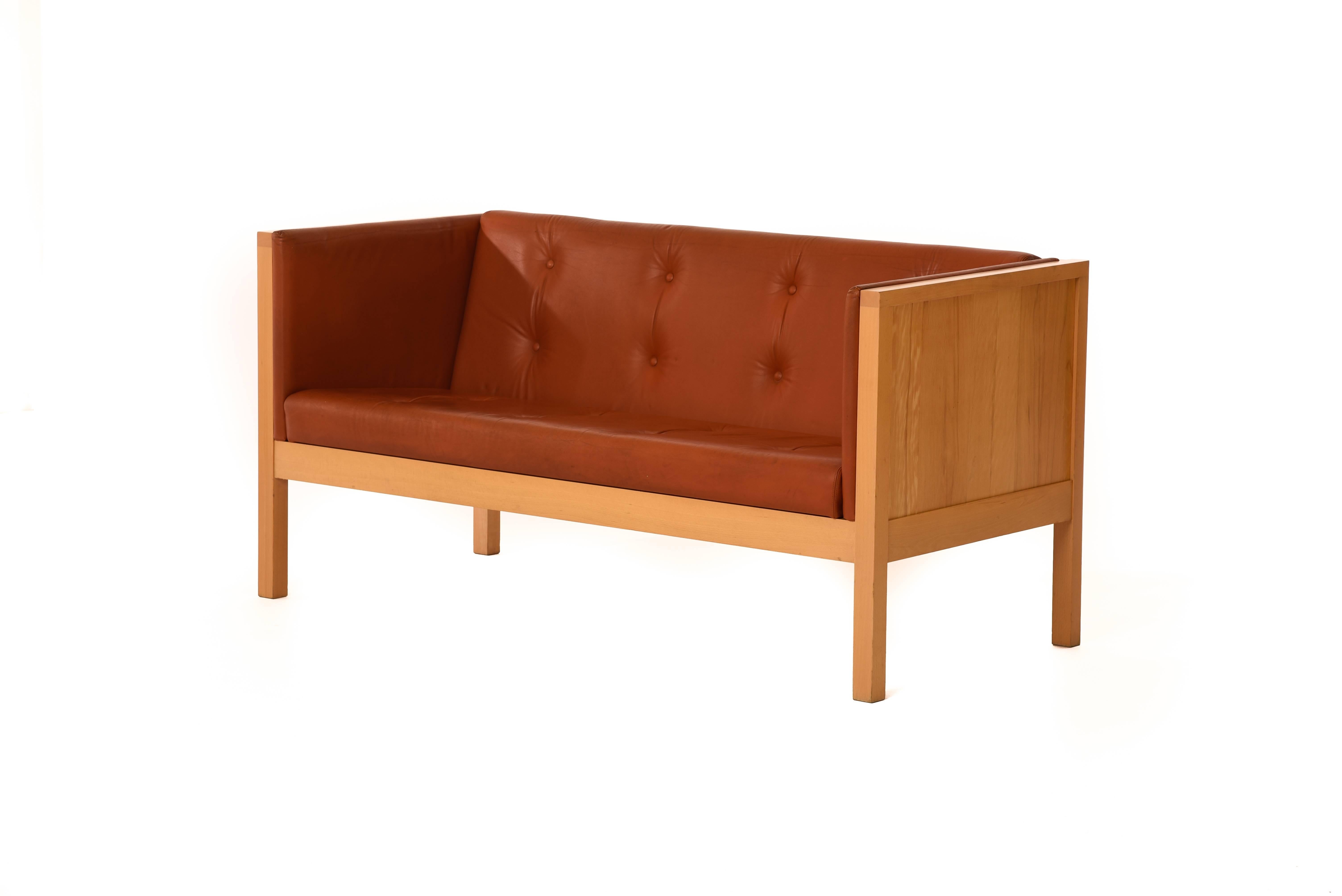 Scandinavian Modern beech panelled sofa produced by Swedish manufacturer Garsnas. Vintage original tufted leather upholstery.

Professional, skilled furniture restoration is an integral part of what we do every day. Our goal 
is to provide