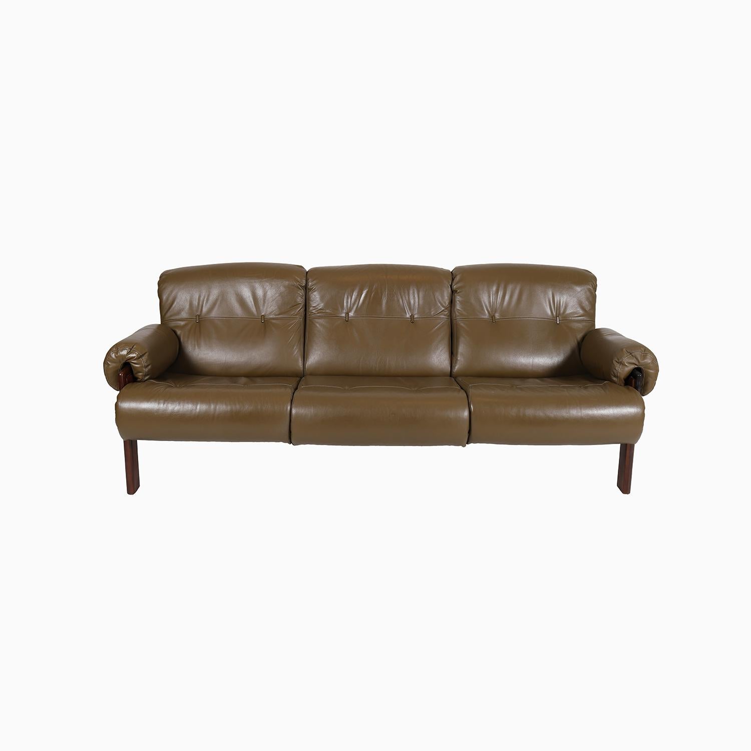 
This classic 1970's Brazilian Modern sofa has leather webbing support and olive green leather cushions.  Lacquer finished rosewood frame. 

Professional, skilled furniture restoration is an integral part of what we do every day. Our goal 
is to