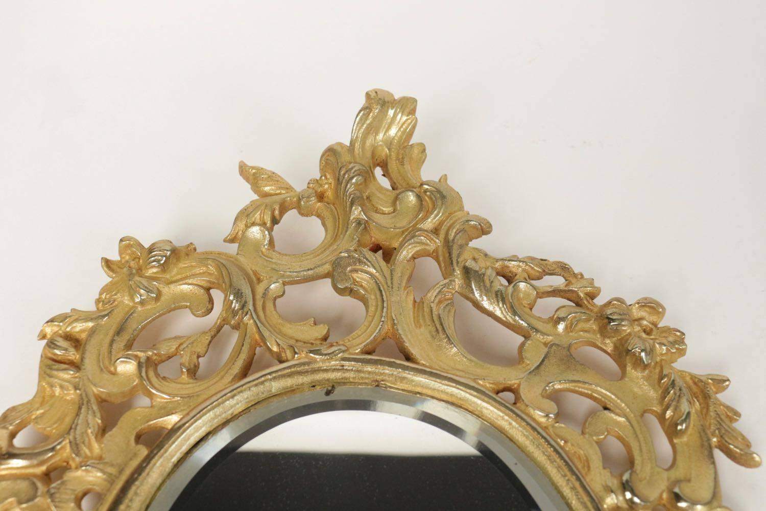 Pair of gold gilt bronze mirrors from the 19th century. Original bezelled mirrors of mercury. Measures: 49cm x 30cm x 4 cm.
 