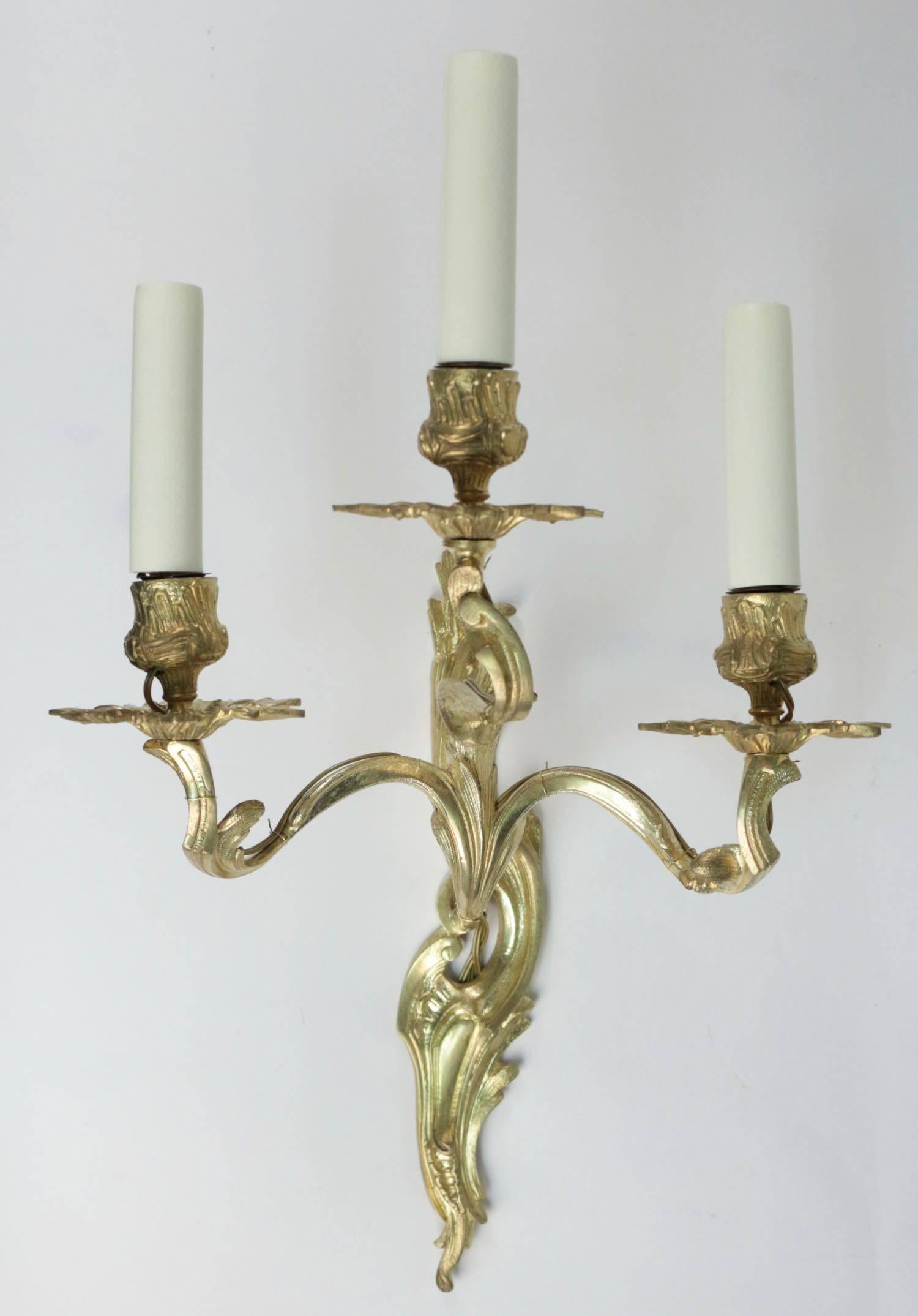 French Pair of Louis XV Style Three Armed Sconces in Gold Gilt Bronze
