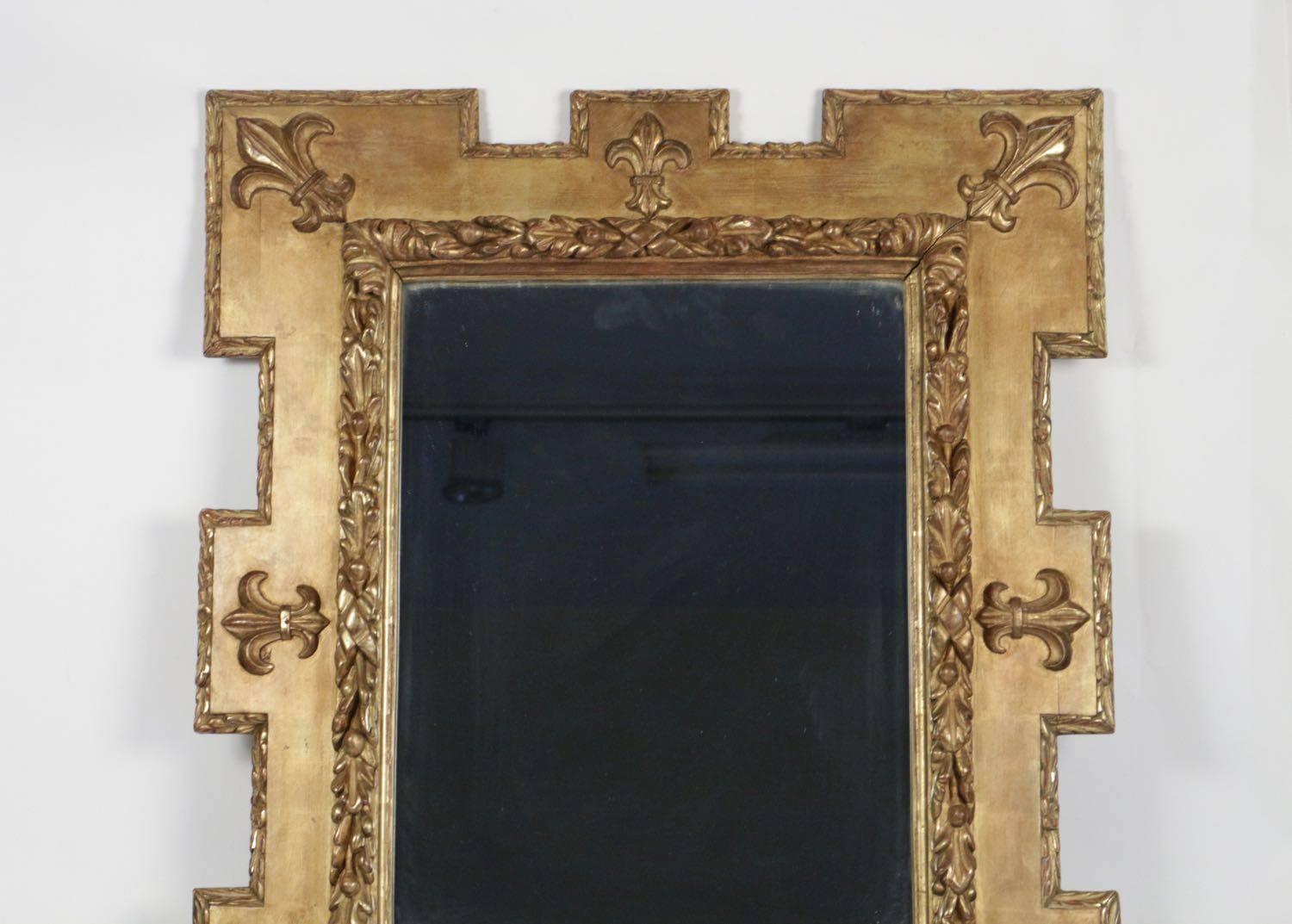 Very pretty gold giltwood and gesso mirror with the fleur de lys design from the 19th century. Original mercury mirror. Measures: H 93cm, L 78cm, P 7cm.
 