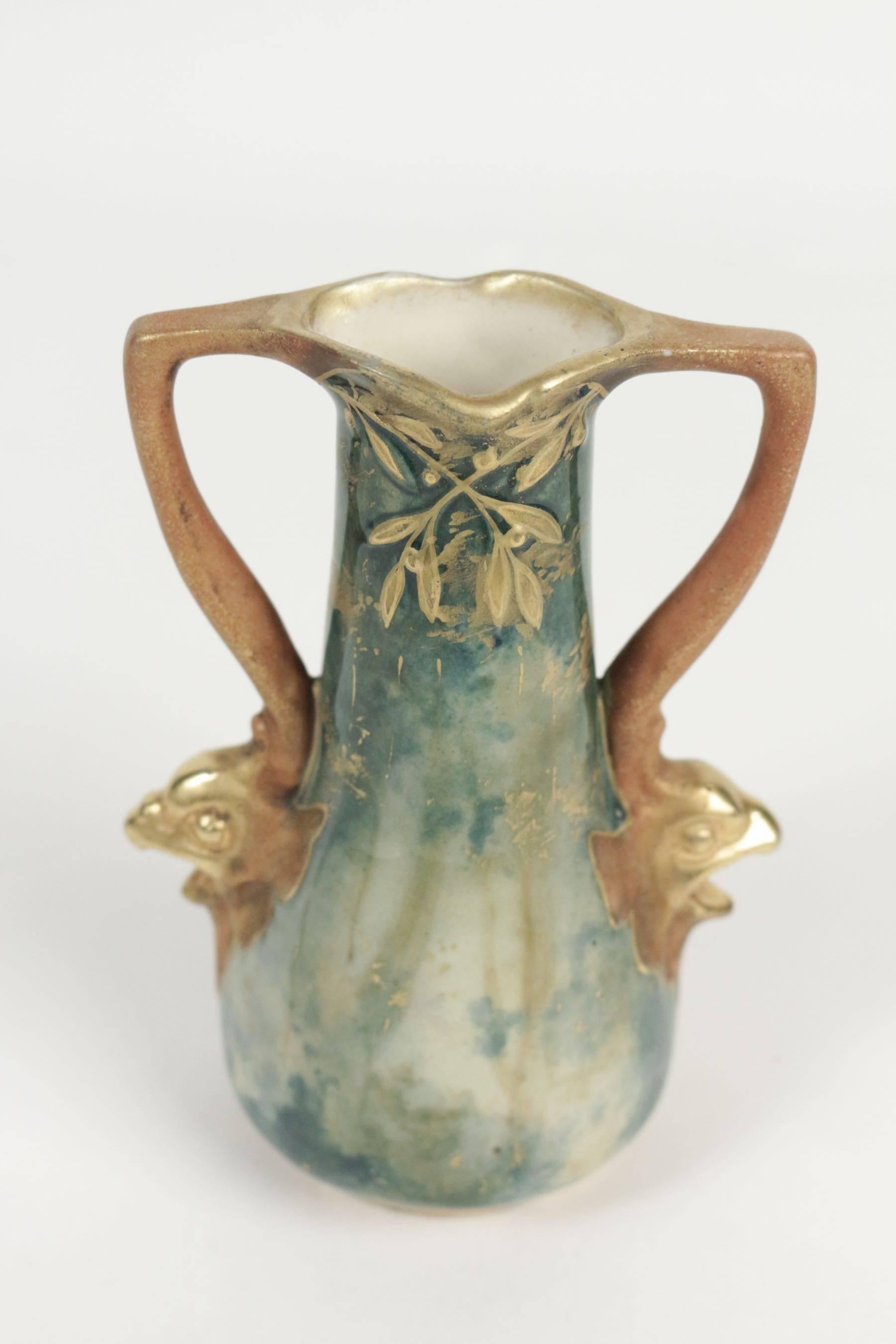 Amphora shaped earthenware vase, Viennese, Austria, circa 1900 with handles in shapes of fish.
 