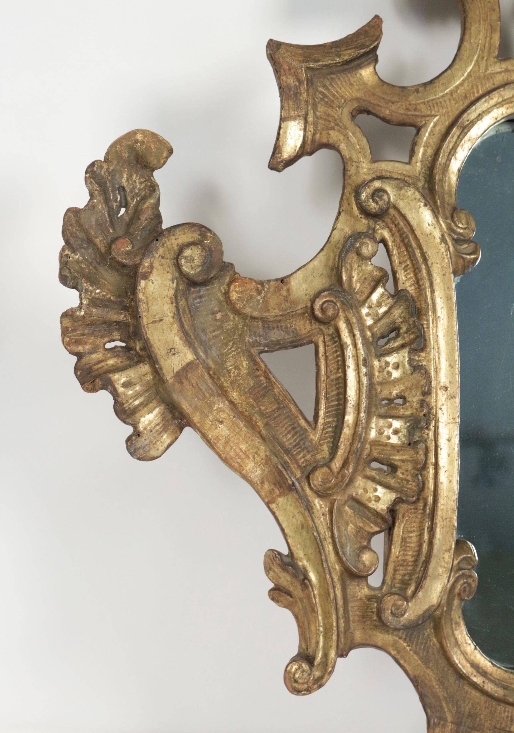 Louis XV mirror in hand-carved gold gilded wood with mercury mirror, 18th century.