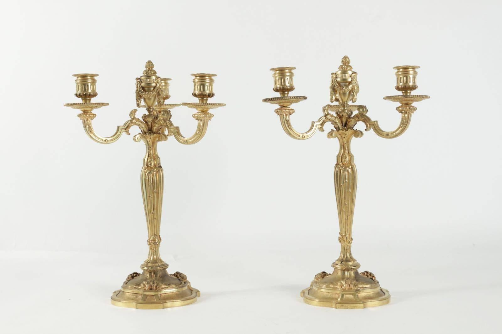 Pair of candelabra in the style of Louis XV in gold gilt bronze, 19th century.
 