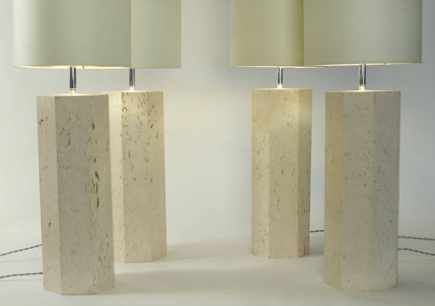 Set of four lamps in travertine marble, circa 1940.
  