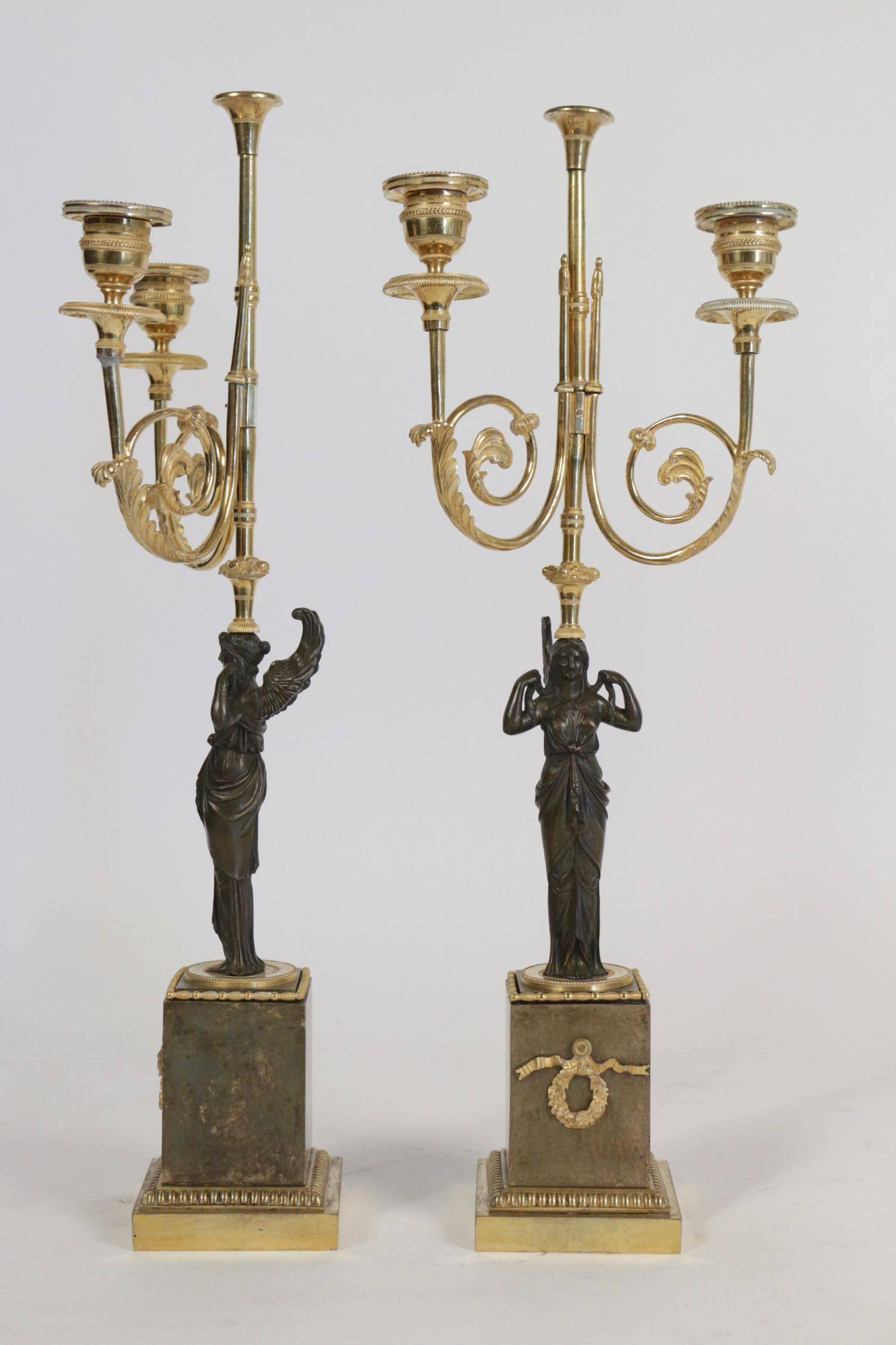 Pair of 18th century bronze candlesticks in gold gilt with marble base. 
Measures: 49cm tall x 18cm wide x 14cm deep.