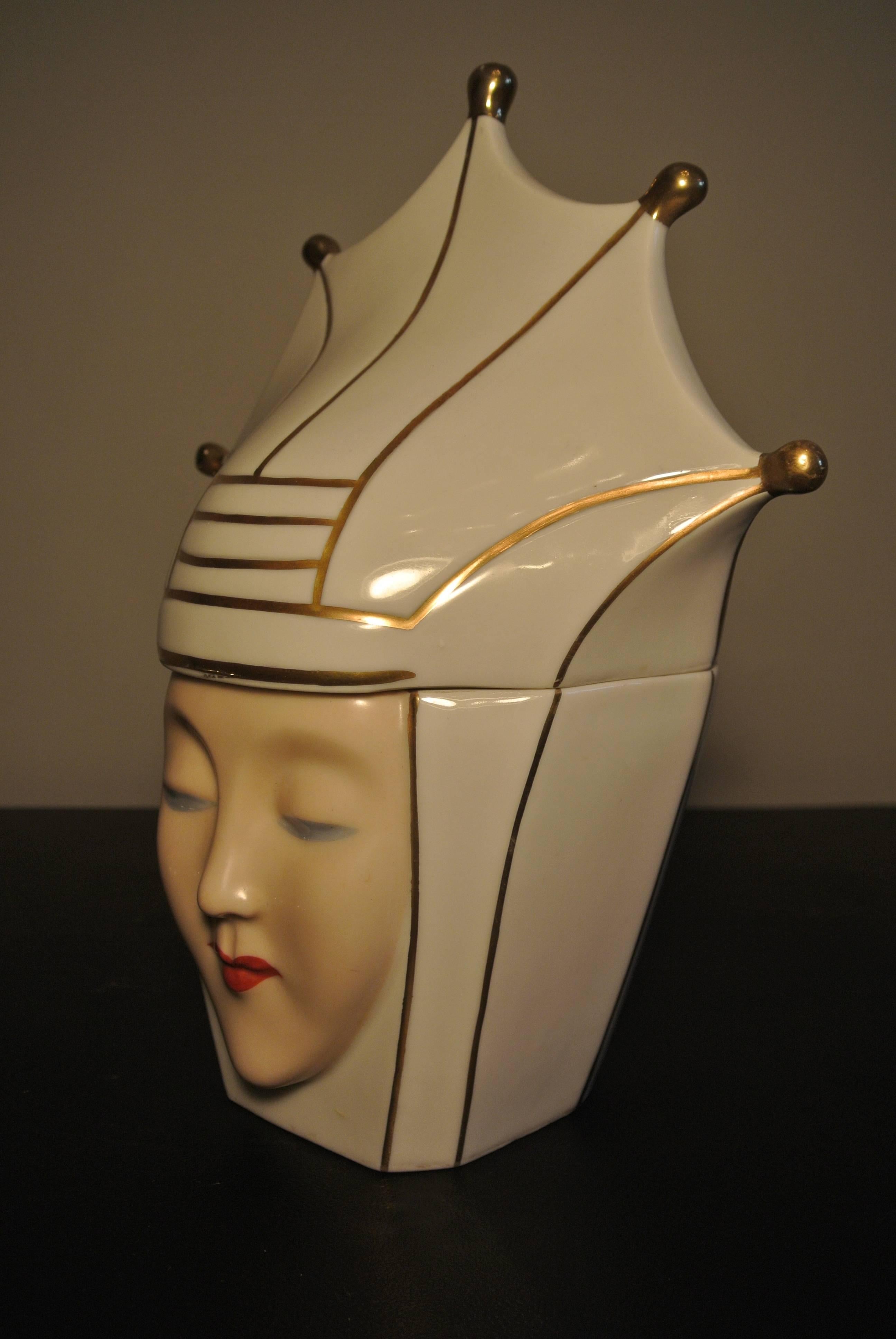 A rare porcelain Art Deco box in the form of a Jokers Head by ROBJ, circa 1930.