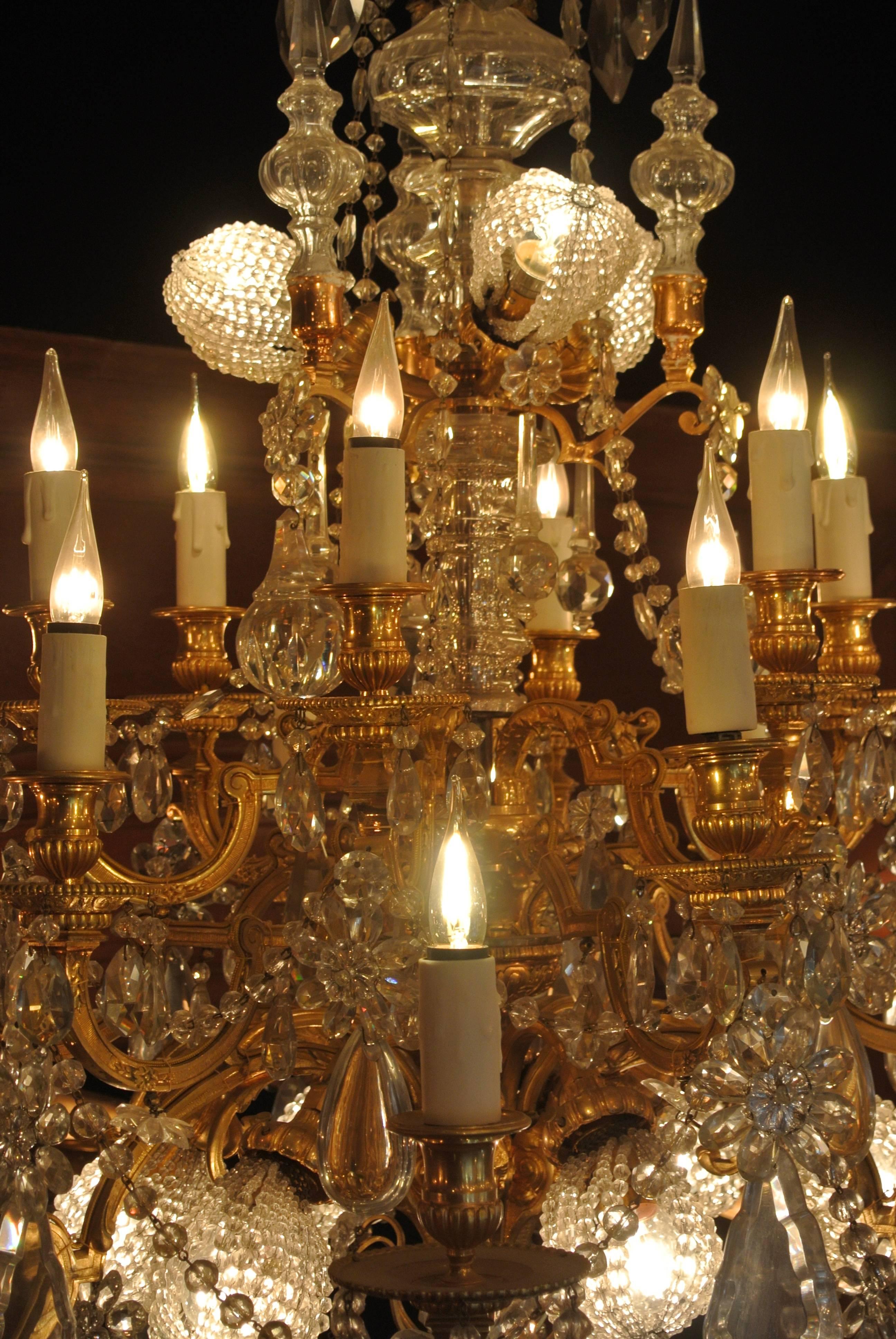 French A Fine Important Baccarat Crystal Chandelier in Bronze Dore and Carved Crystal