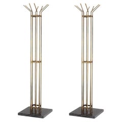 Pair of Coat Racks in Patinated Brass with a Black Marble Base.