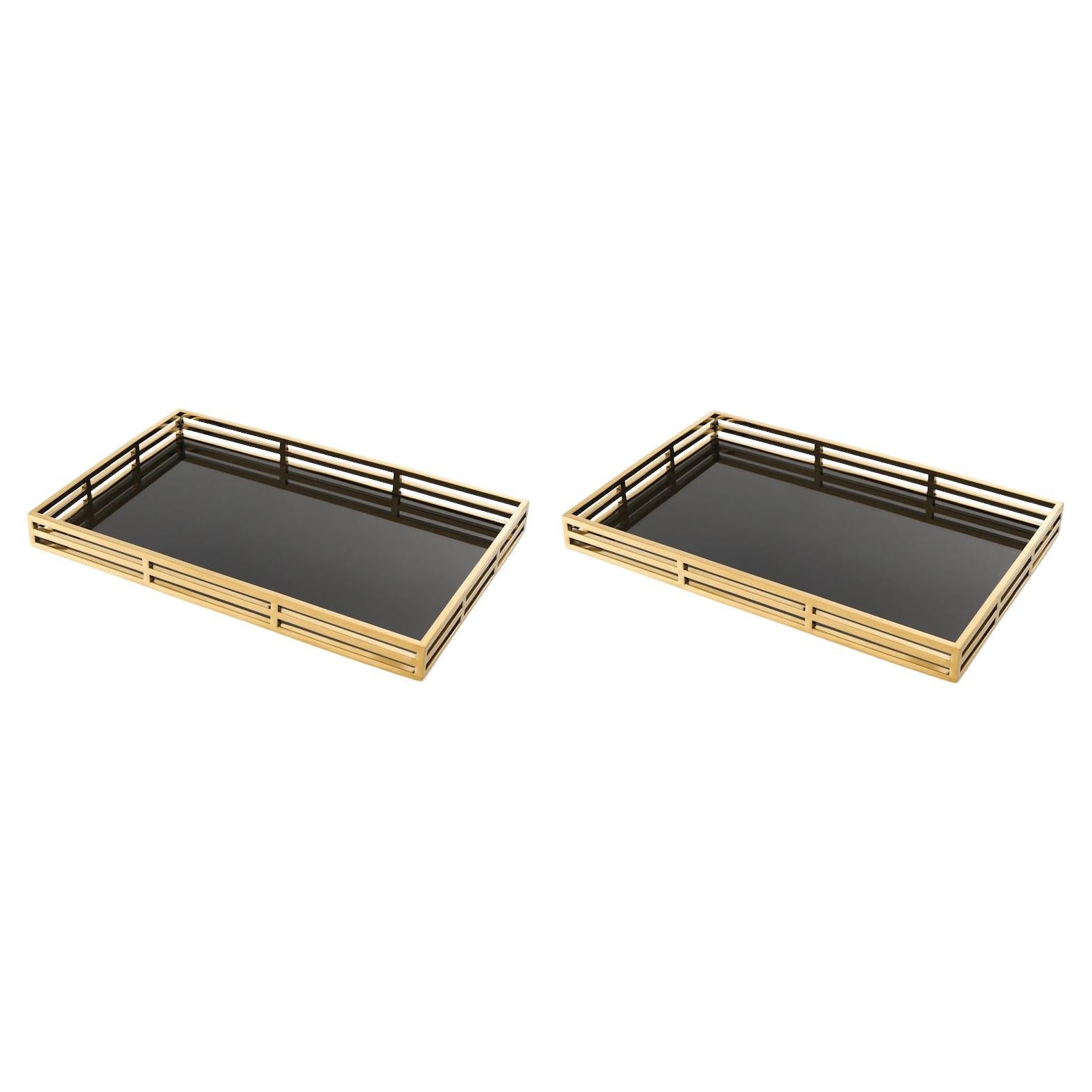 Paar Tabletts, vergoldetes Metall, schwarzes Glas, Art Déco-Stil.