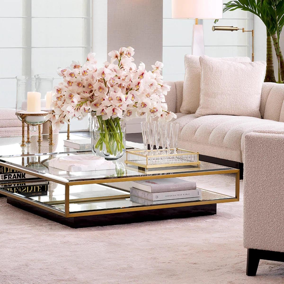 Pair of rectangular trays, patinated brass, mirror, and clear glass.

Embellish your home with this decorative tray.
This elegant rectangular tray, with its mirrored base and clear glass stems, features a patinated brass finish. Ideal as a tray for
