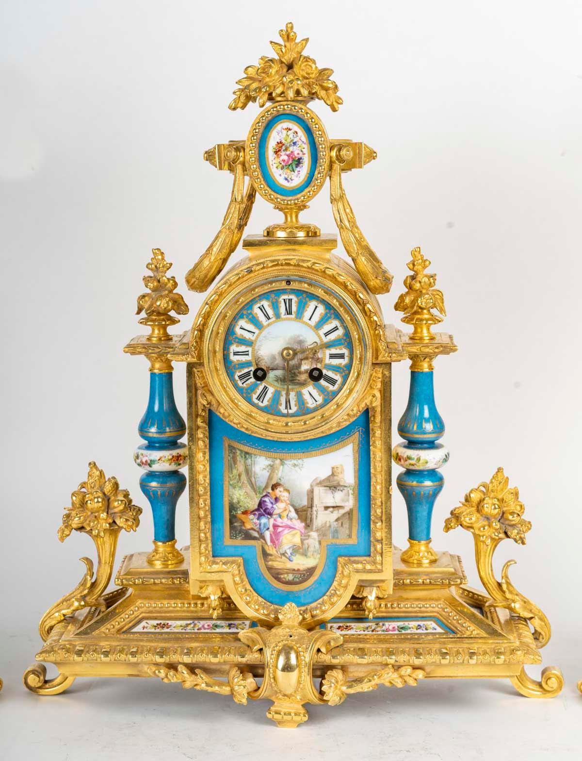 Gilded bronze and Sèvres porcelain mantelpiece set, 19th century, Napoleon III period.

Mantelpiece set, Napoleon III period, 19th century, in gilded bronze and Sèvres porcelain, Louis XVI style.
Clock: H: 49 cm, W: 39 cm, D: 13 cm
Candelabra: H: 53